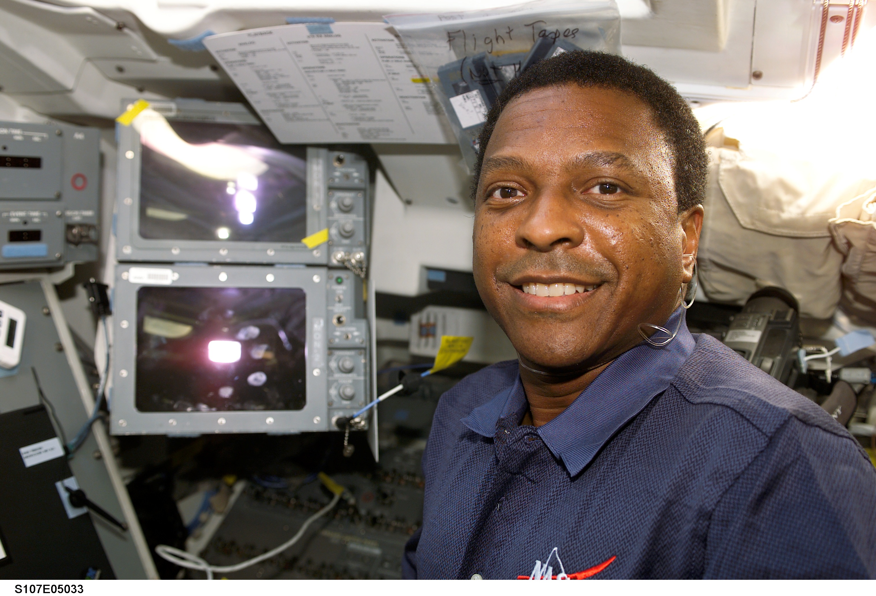 Anderson smiles for the camera on Columbia's AFD during STS-107