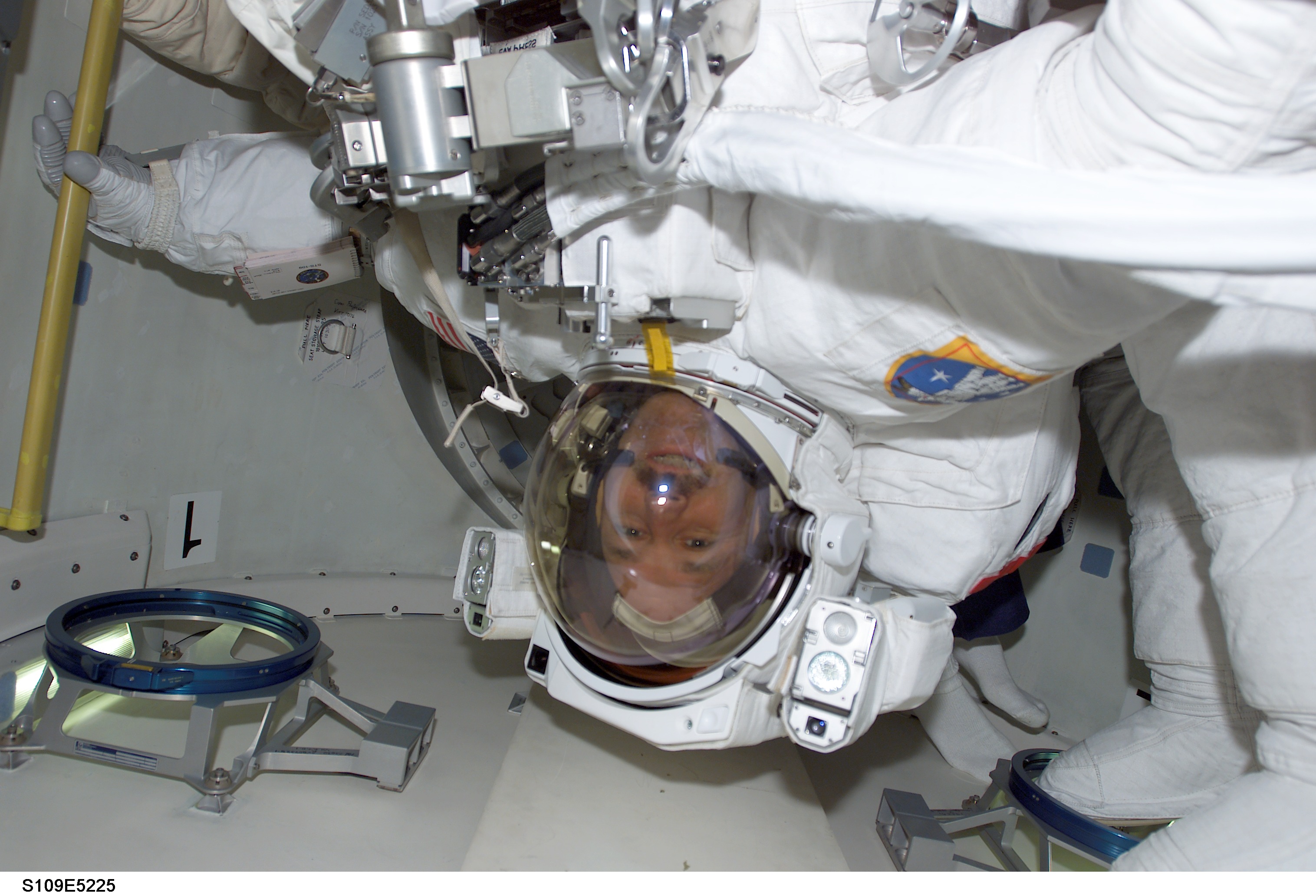 STS-109 MS Grunsfeld in airlock prior to EVA