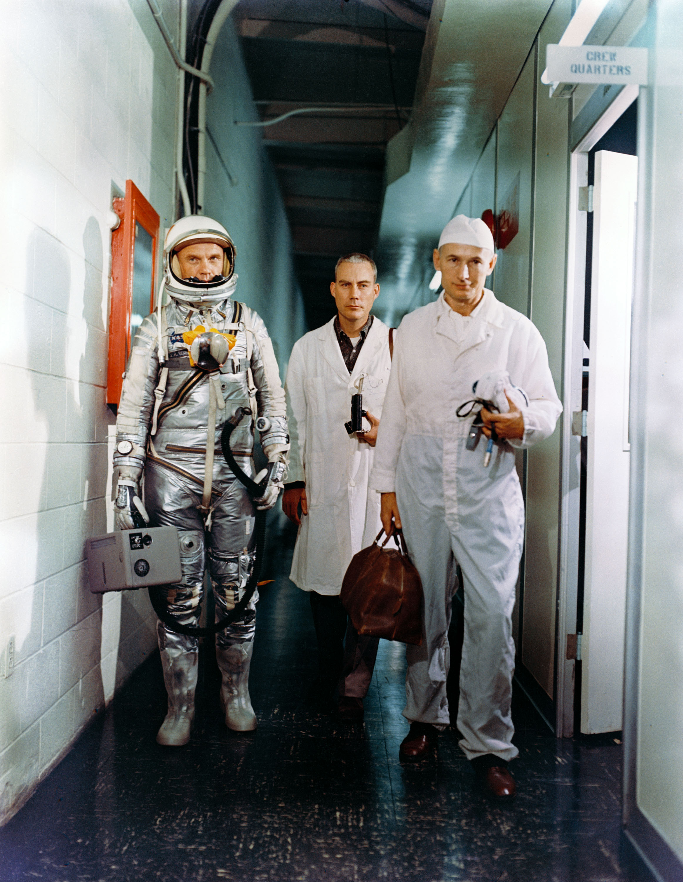 Astronaut John Glenn leaving crew quarters prior to launch