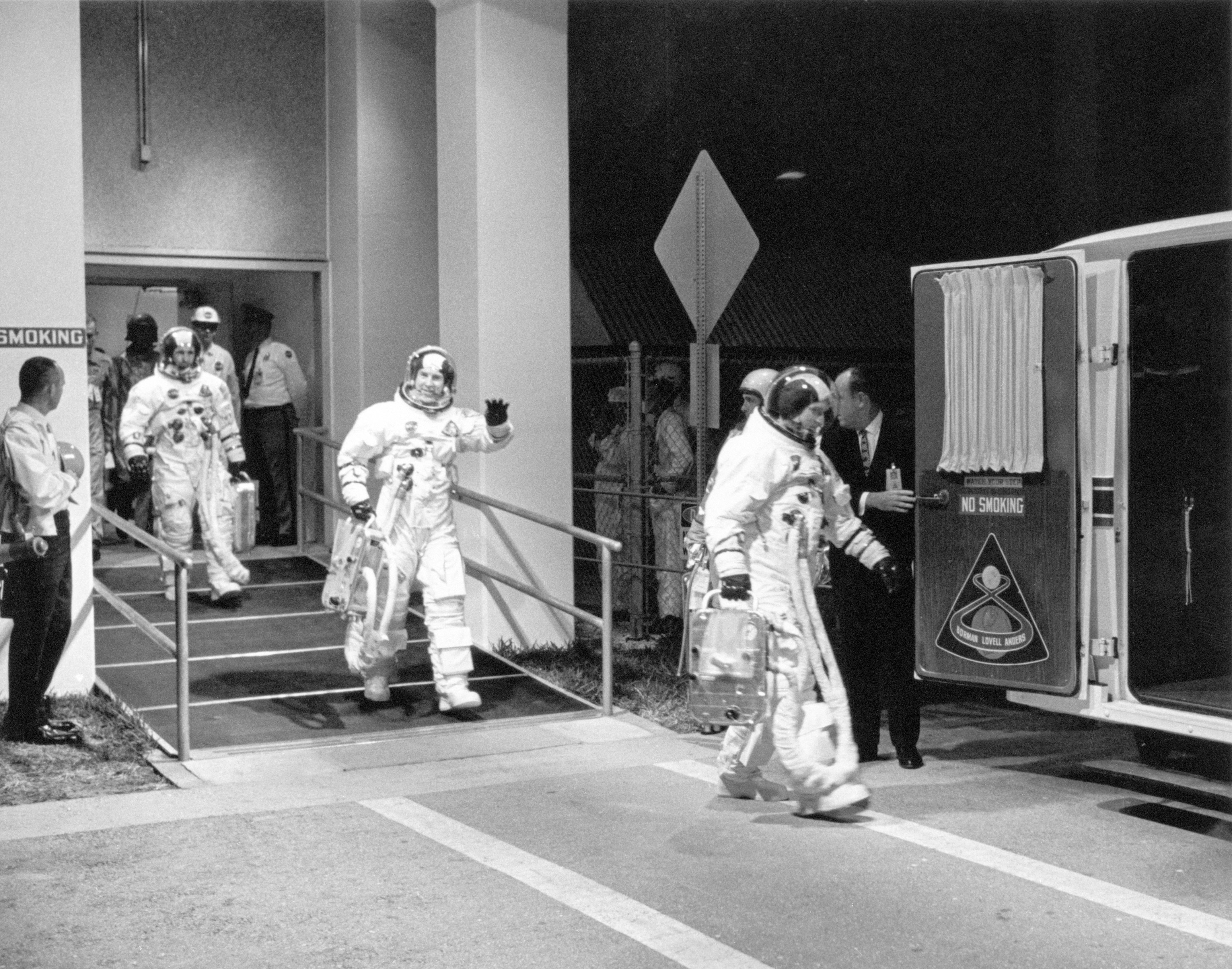 Apollo 8 crew leaves Manned Spacecraft Operations Bldg during countdown