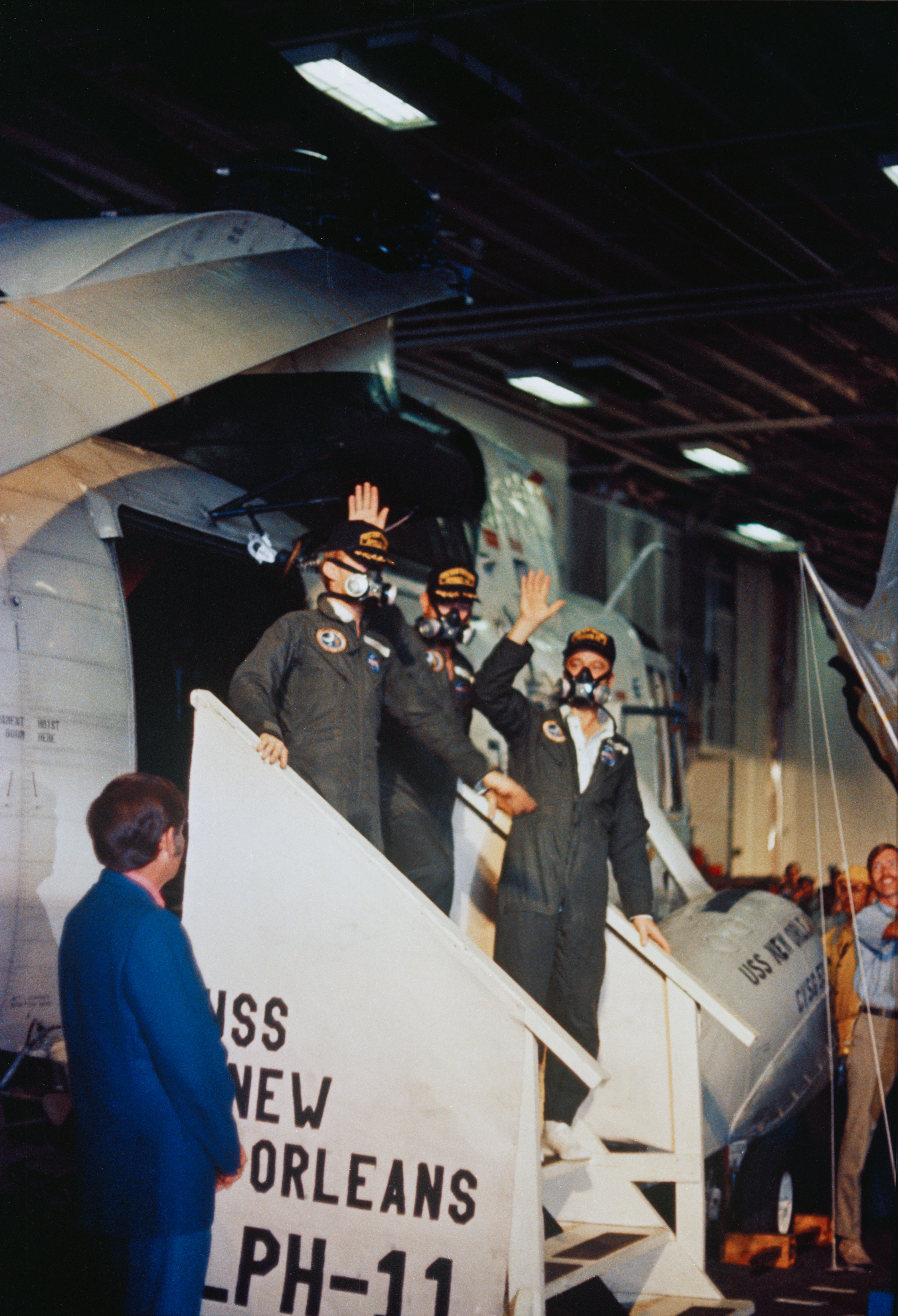 Apollo 14 crewmen step aboard U.S.S. New Orleans after splashdown