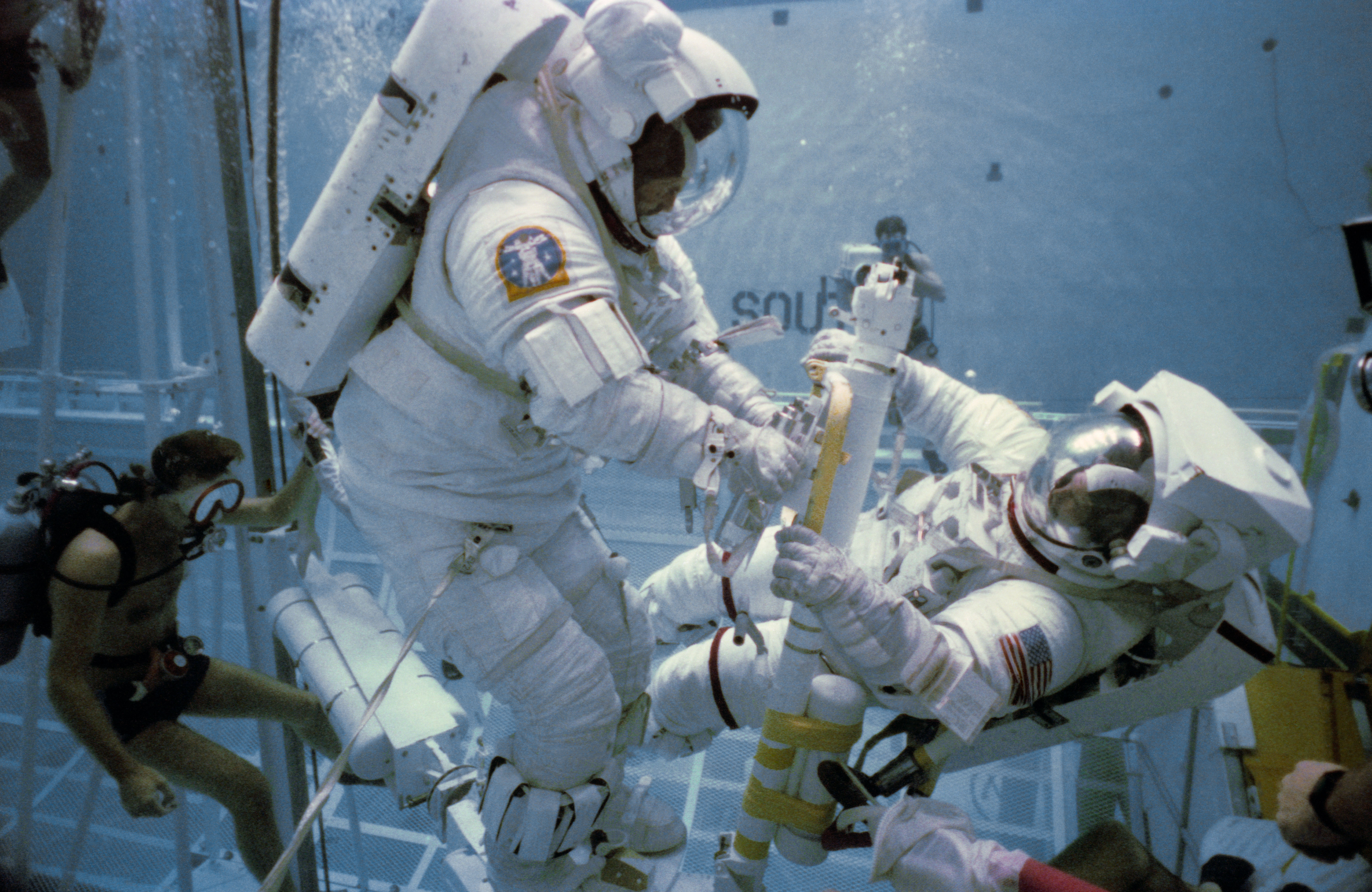 Underwater EVA training in the WETF with astronauts Nelson and van Hoften