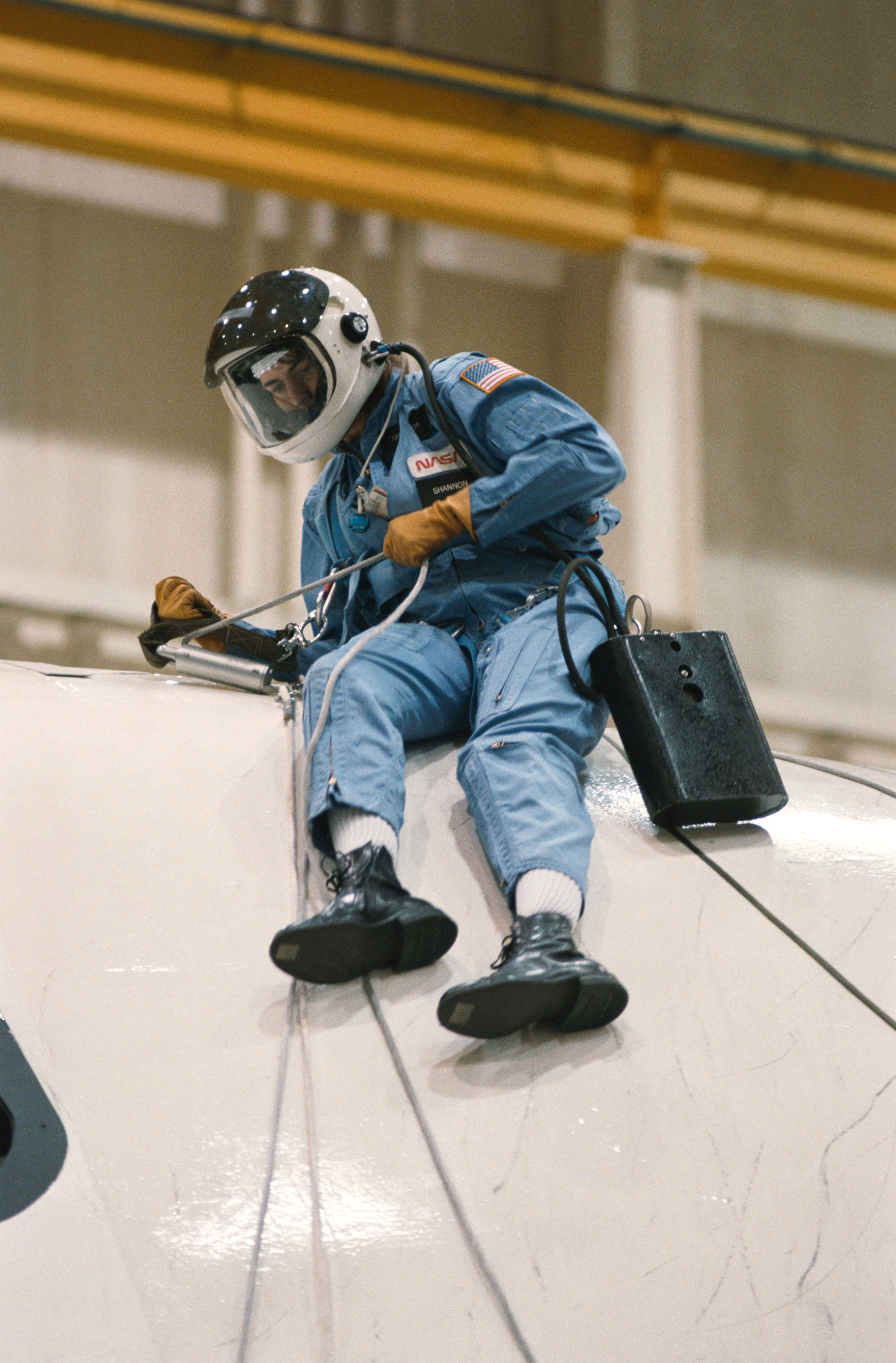 Mission specialist Shannon W. Lucid descends from crew compartment trainer