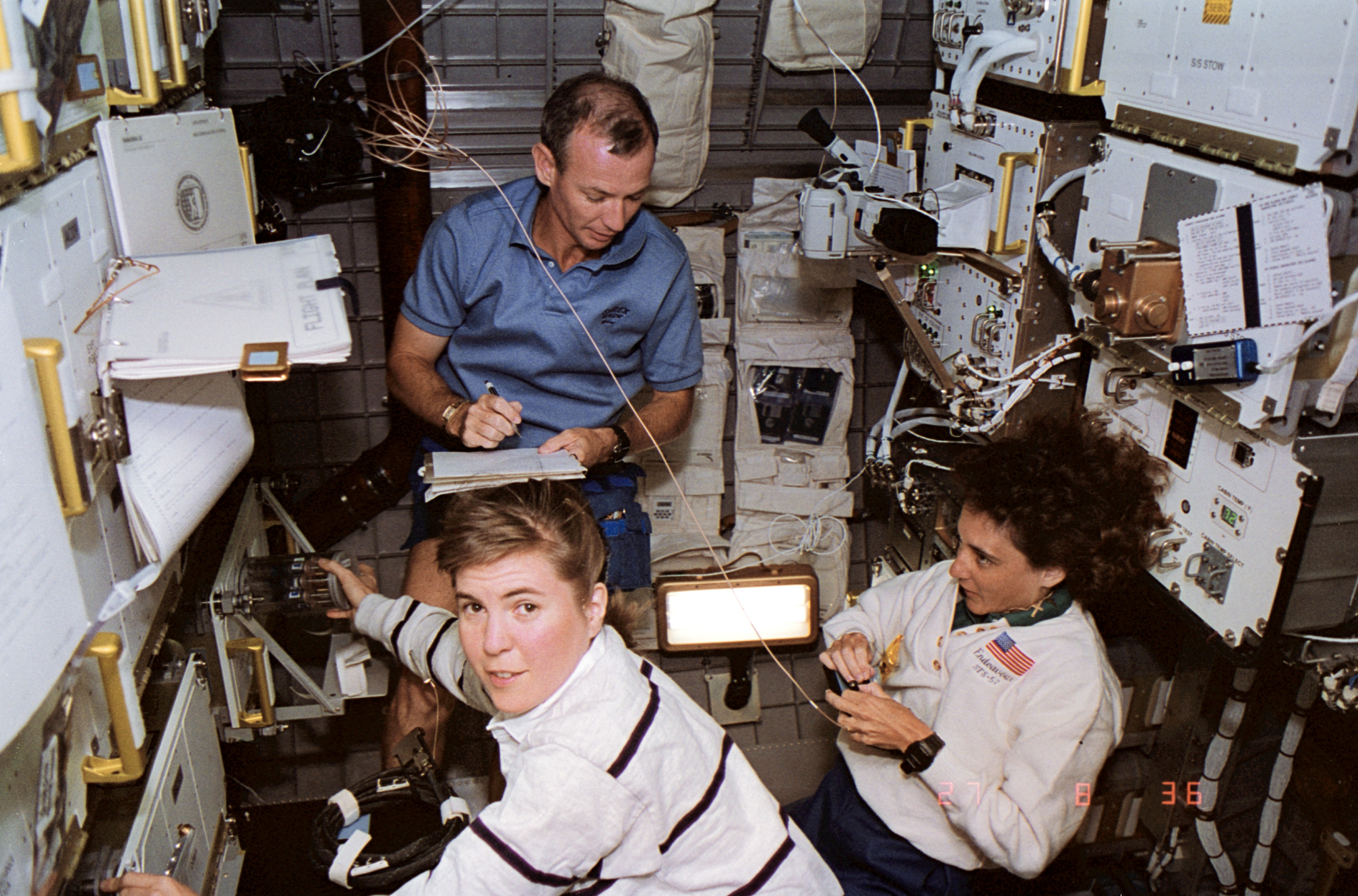 STS-57 crewmembers work inside the SPACEHAB-01 module aboard OV-105