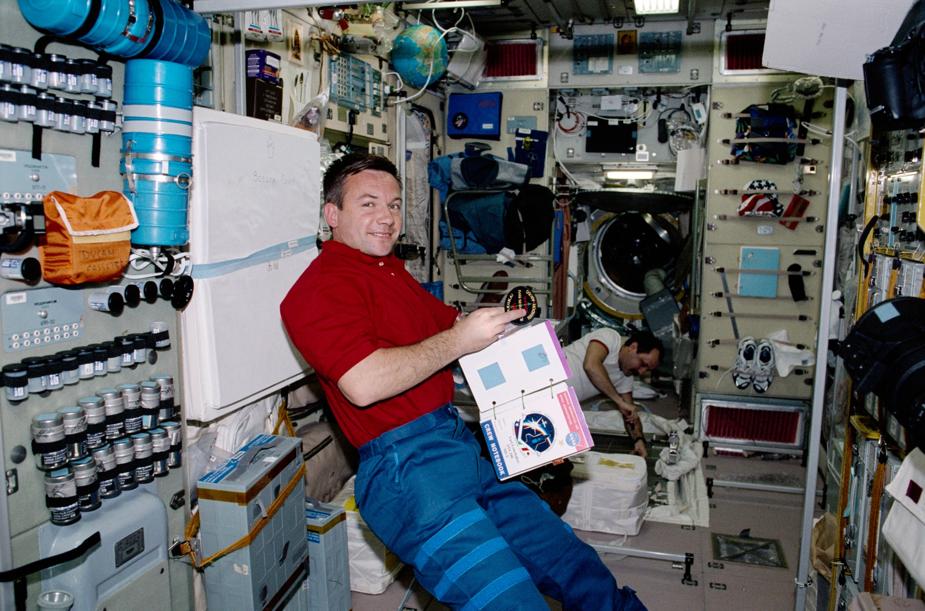 Lonchakov and Usachev work on TVIS in Zvezda during STS-100's visit