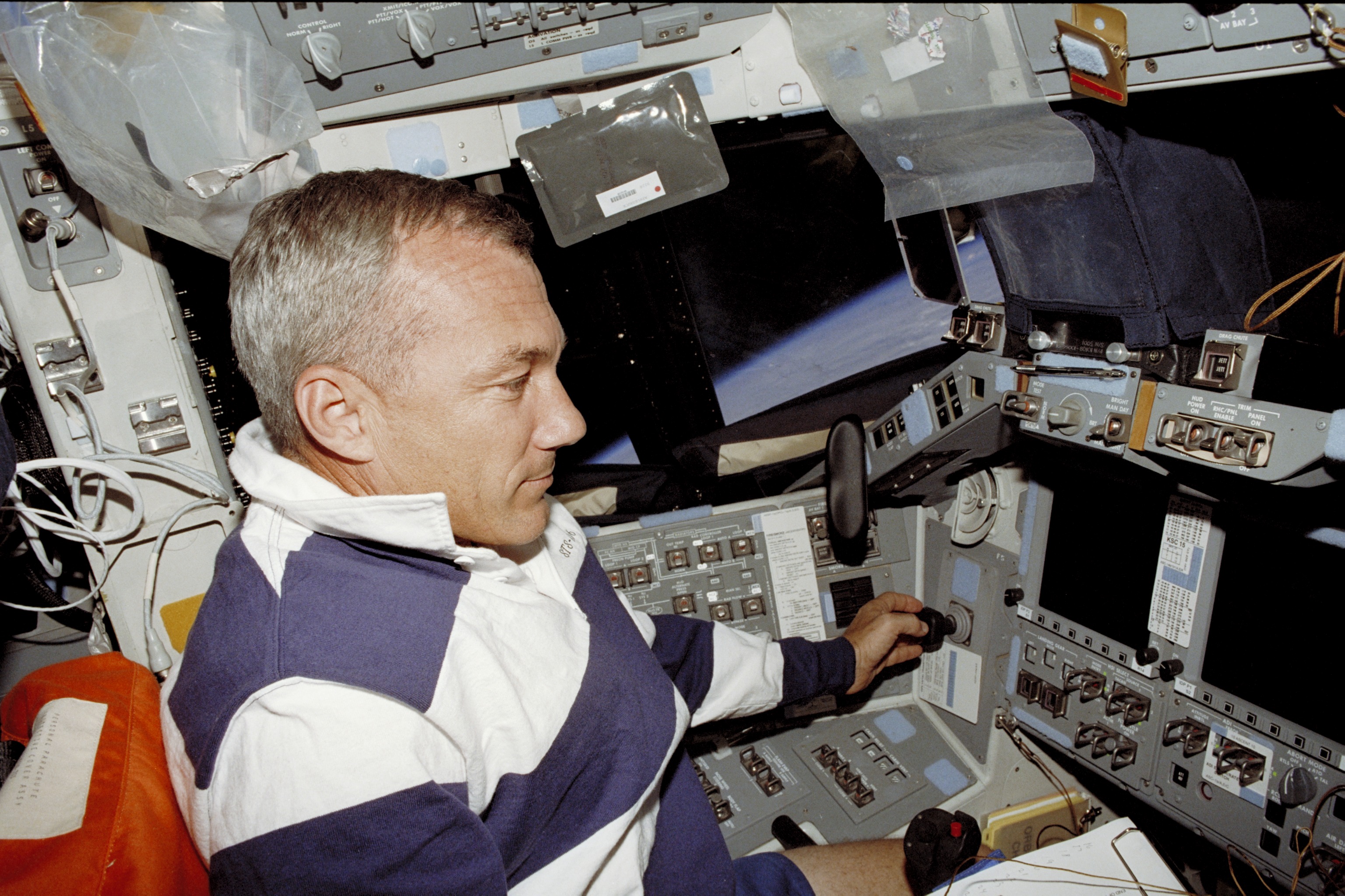 Commander Wilcutt works at the commander's workstation during STS-106