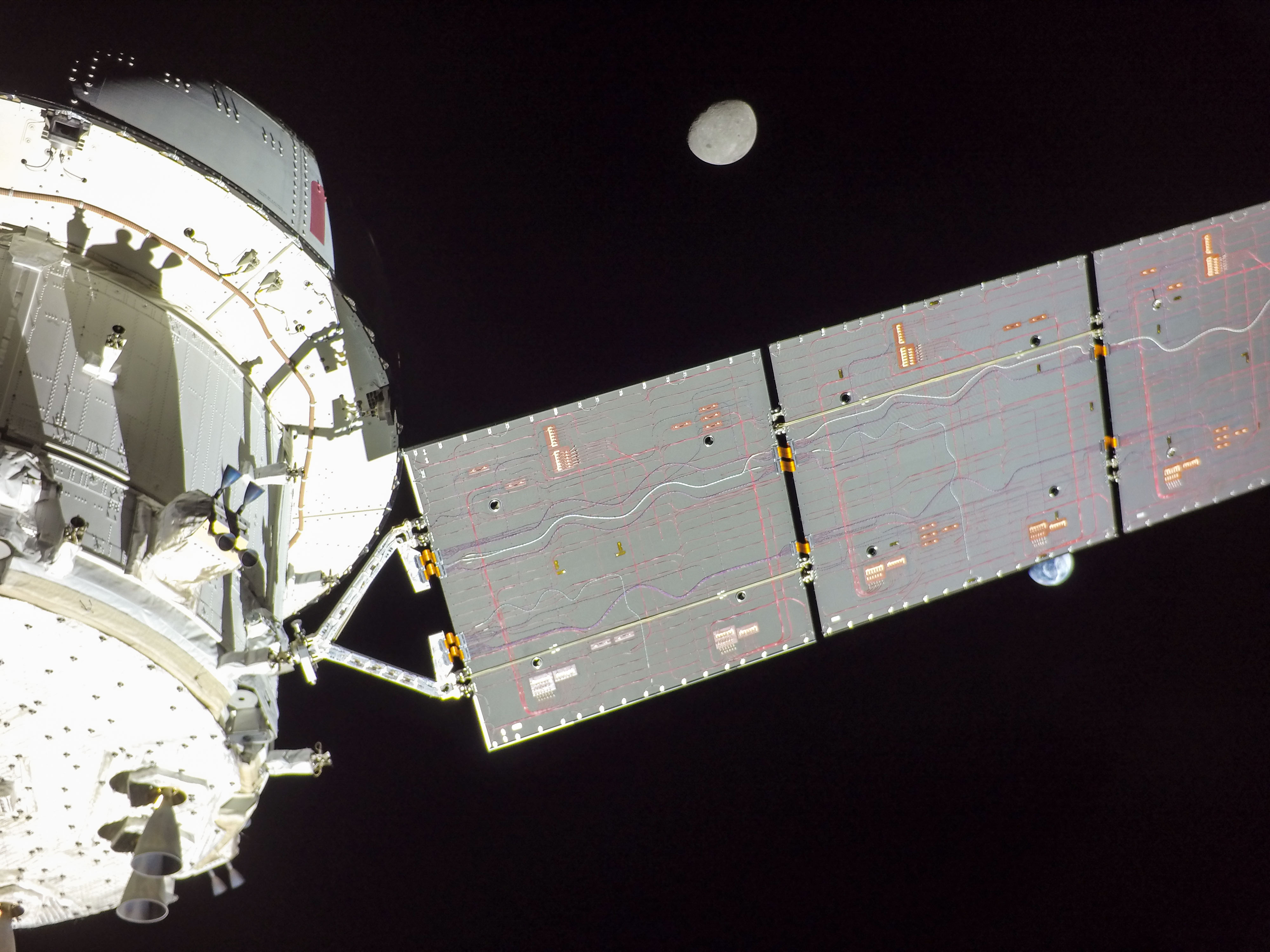 Flight Day 14: Orion's Solar Array Divides Earth and Moon