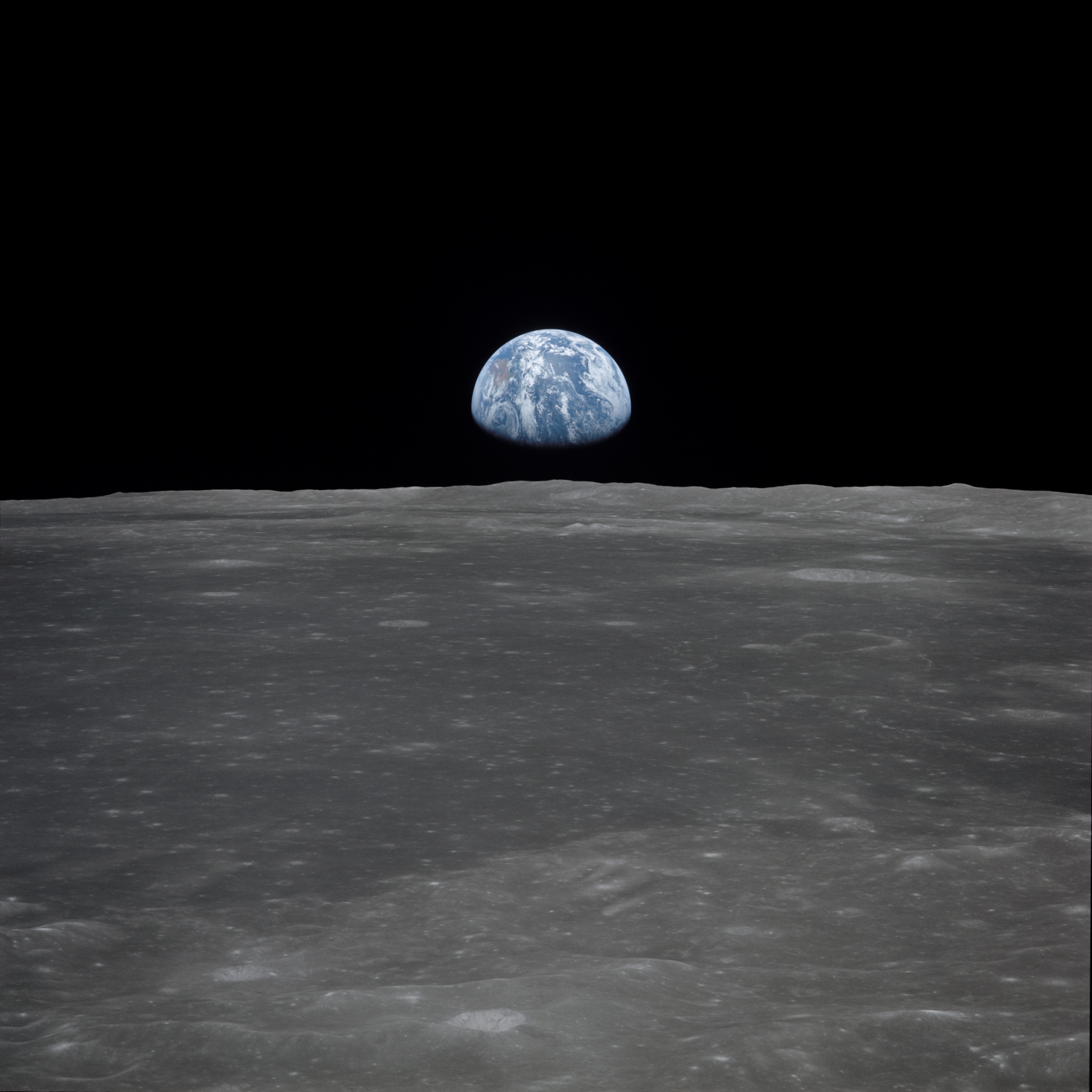 Apollo 11 Mission image - View of moon limb,with Earth on the horizon,Mare Smythii Region