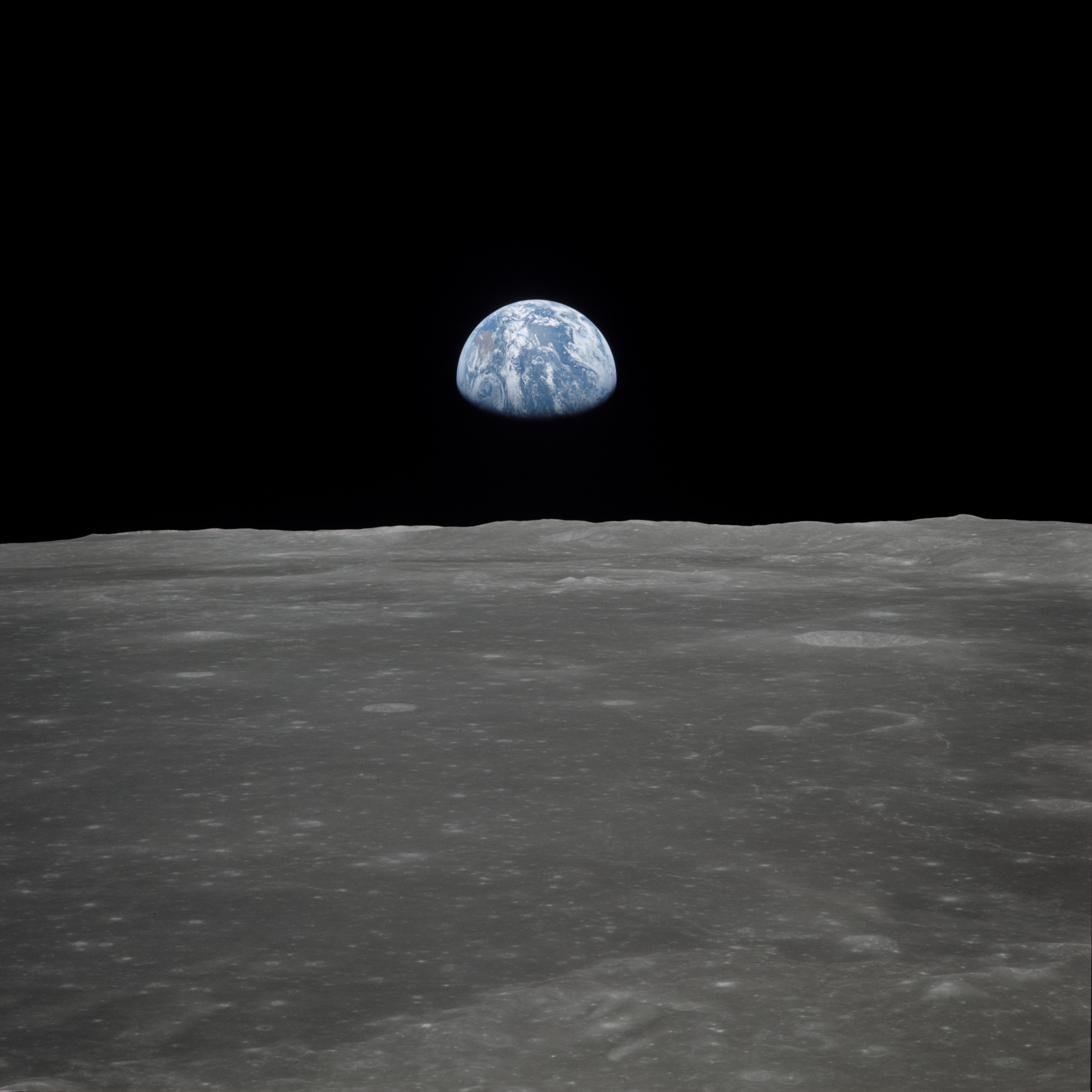 View of Earth rising over Moon's horizon taken from Apollo 11 spacecraft