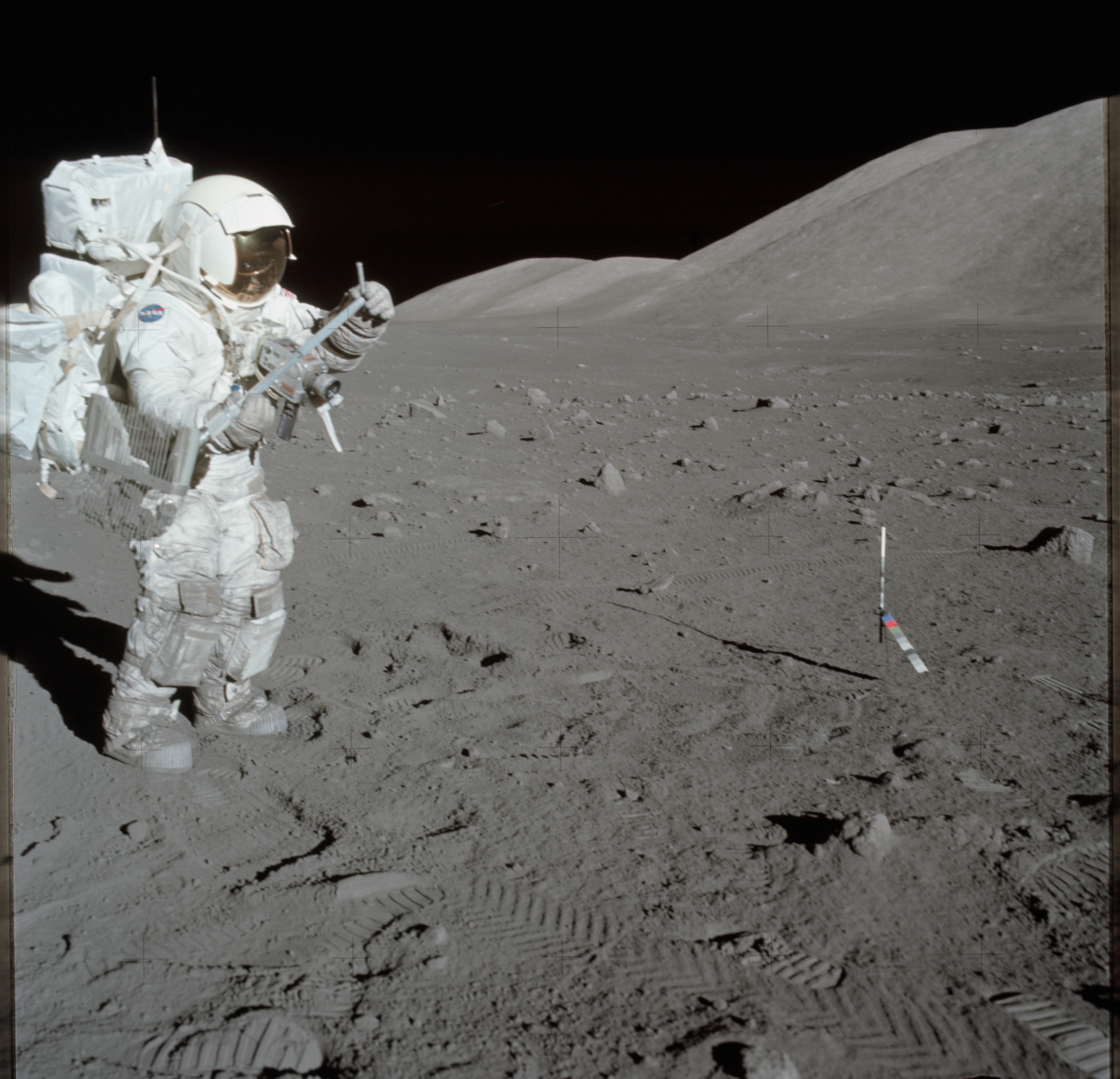 Astronaut Harrison Schmitt collects lunar rake samples during EVA