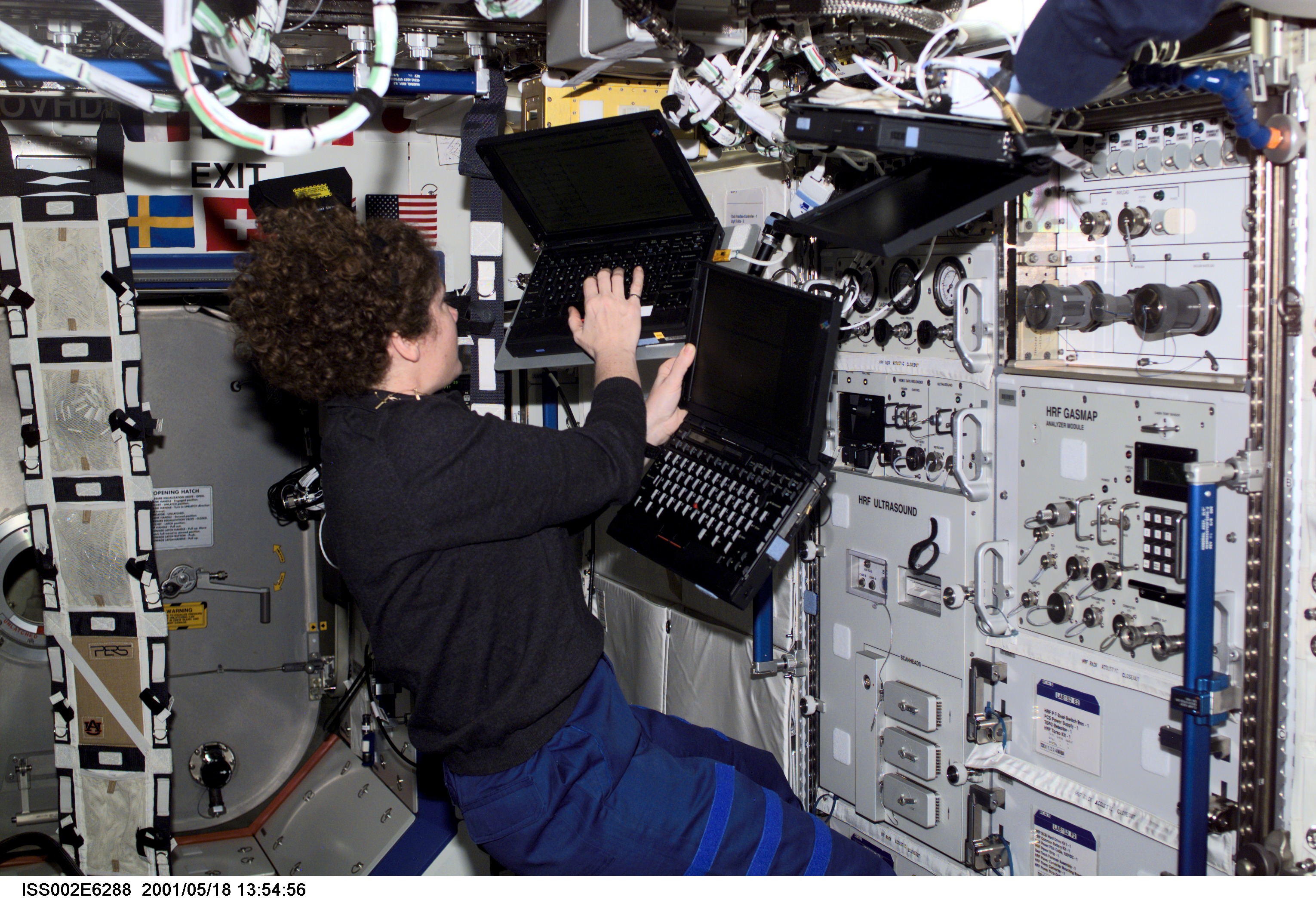 Helms with computers at HRF rack in Destiny module