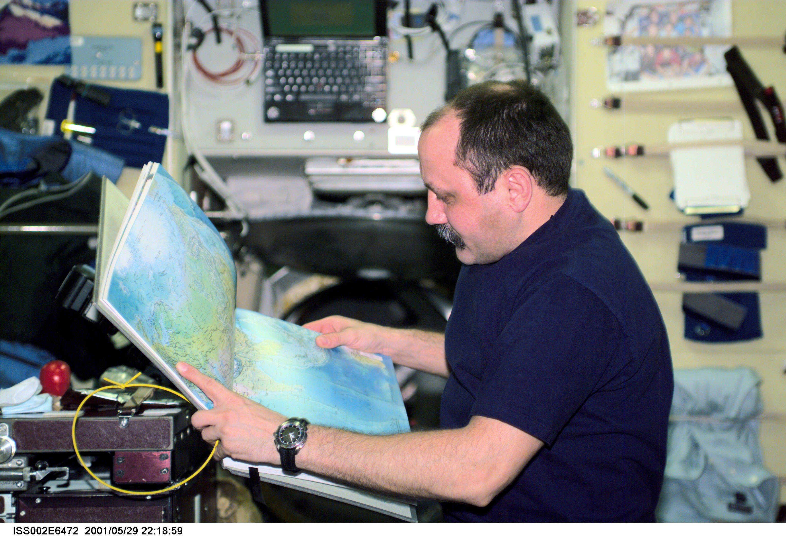 Usachev with atlas in Service Module