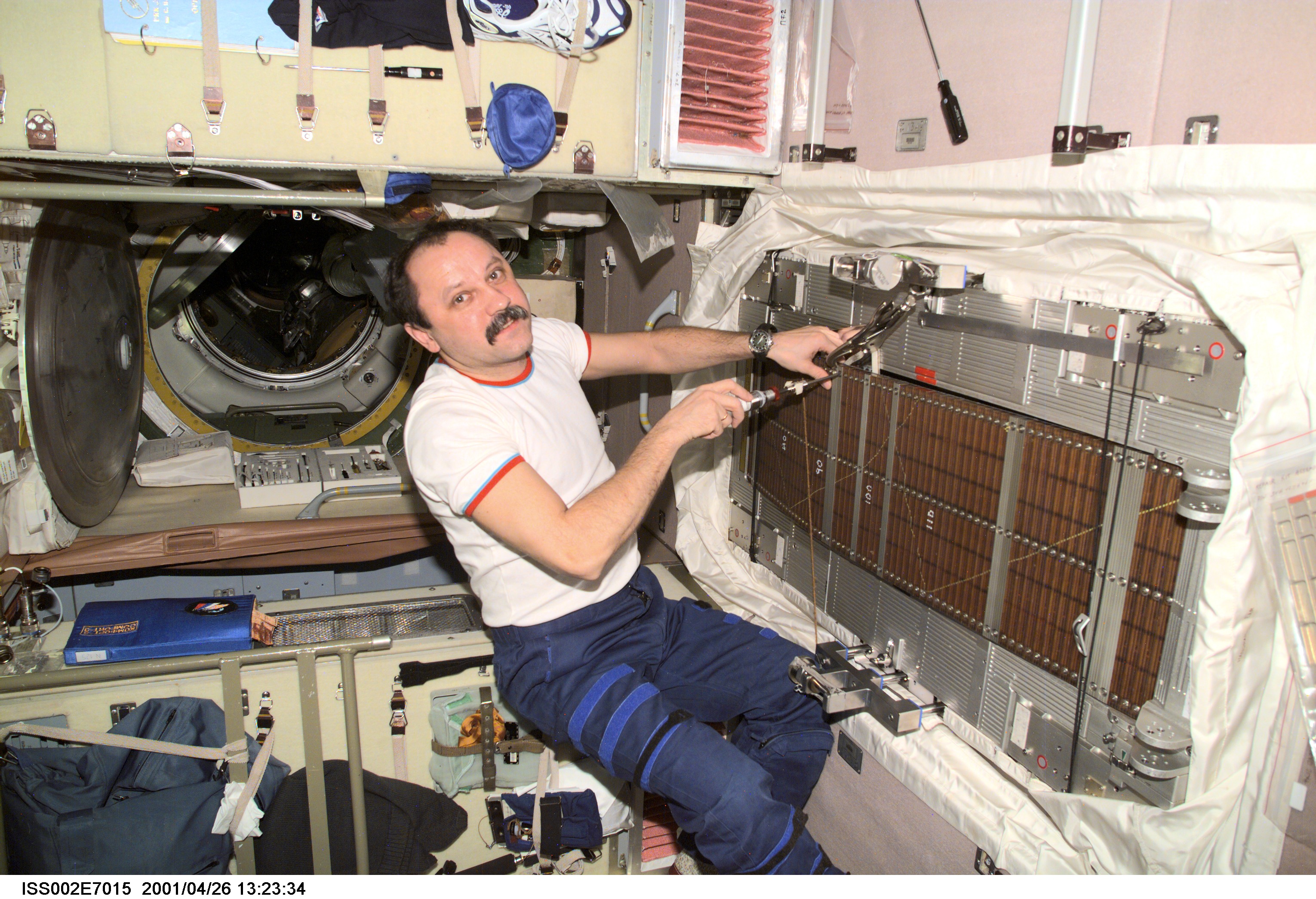 Usachev performs maintenance on TVIS in Zvezda module