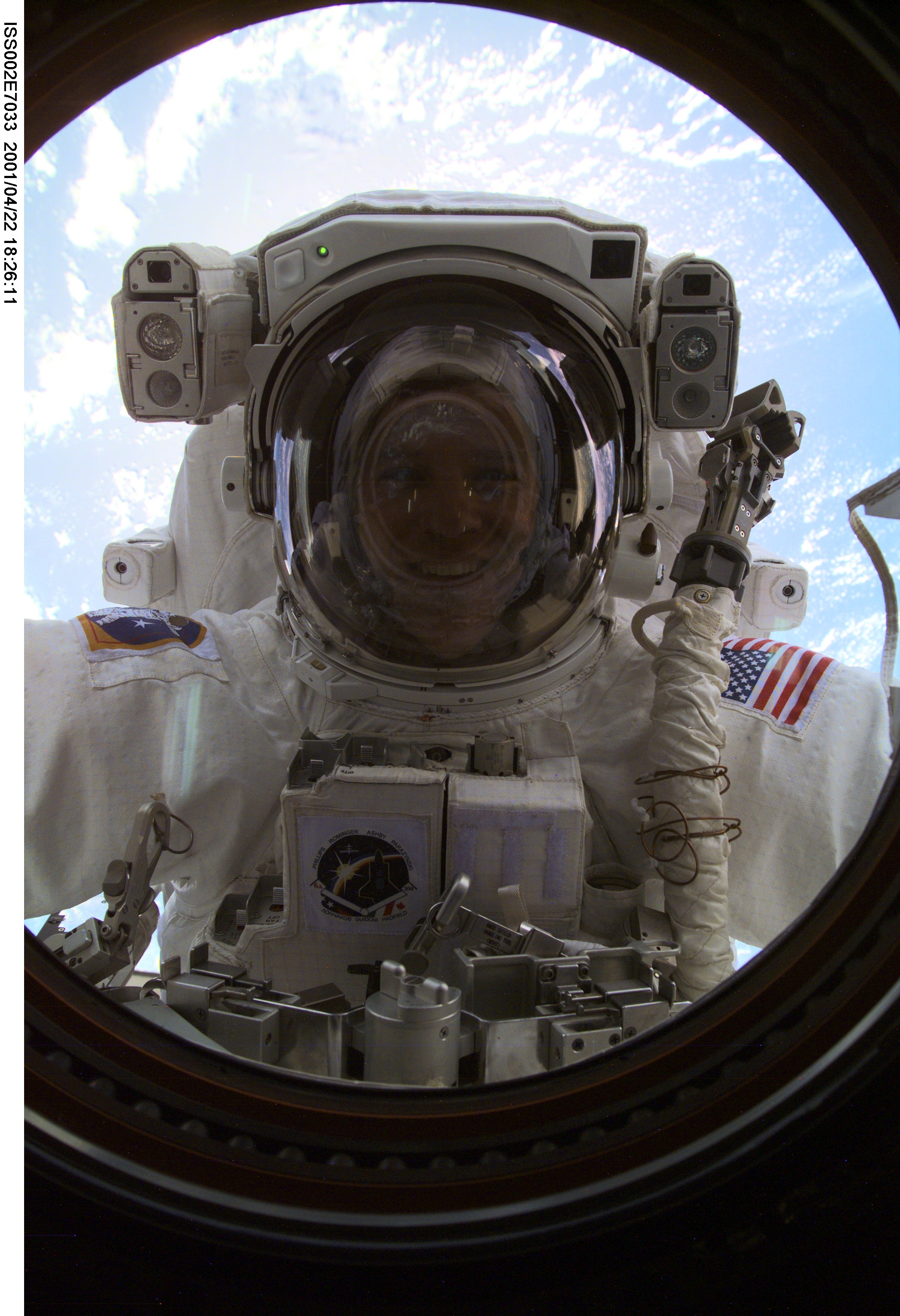 View of STS-100 MS Parazynski during EVA 1 at Destiny laboratory window