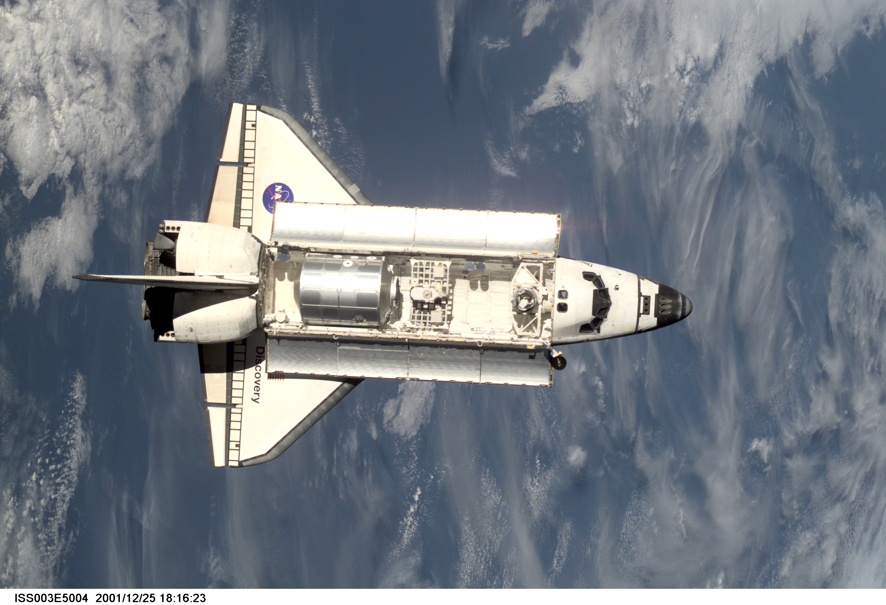 View of Discovery approaching the ISS for docking during the STS-105 mission