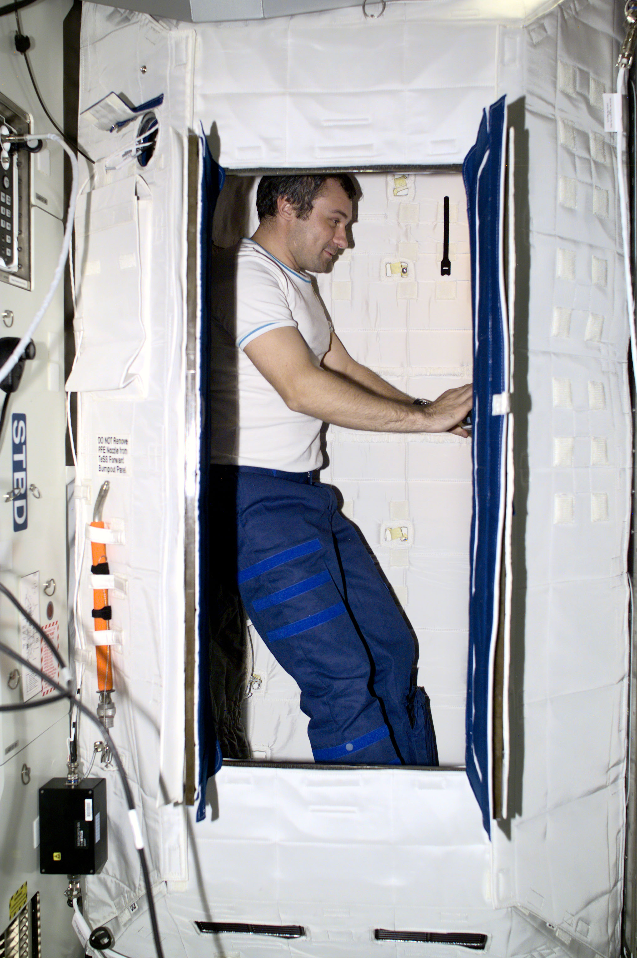 Dezhurov works in the sleep station in the U.S. Laboratory during Expedition Three