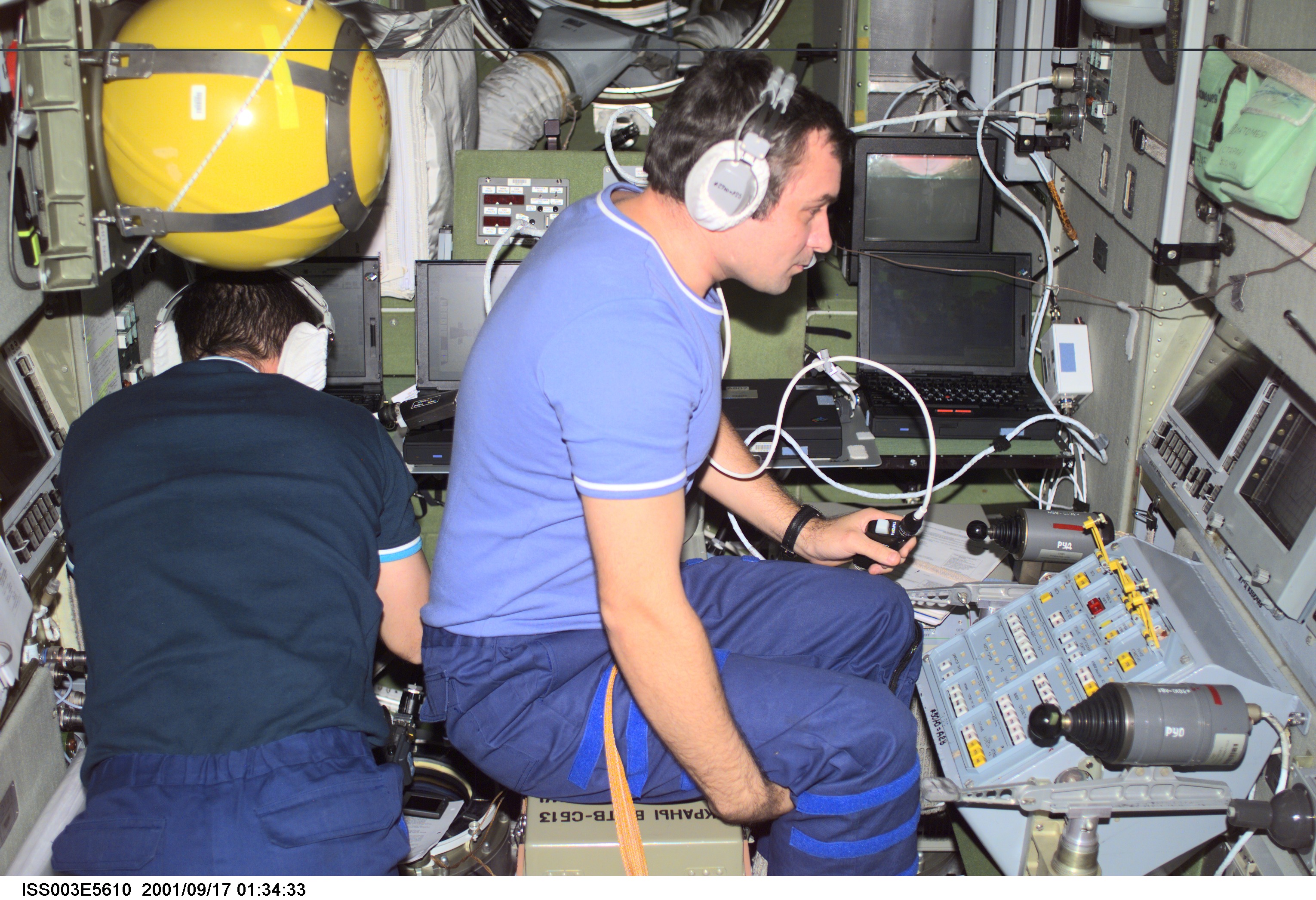 Dezhurov and Tyurin work in Zvezda during Expedition Three