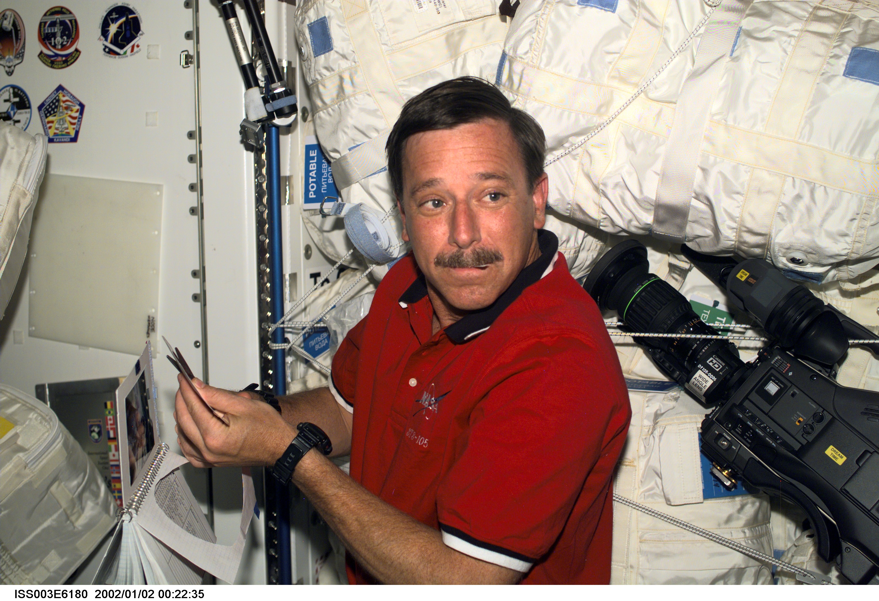 STS-105's Horowitz works on a mission logo in Node 1