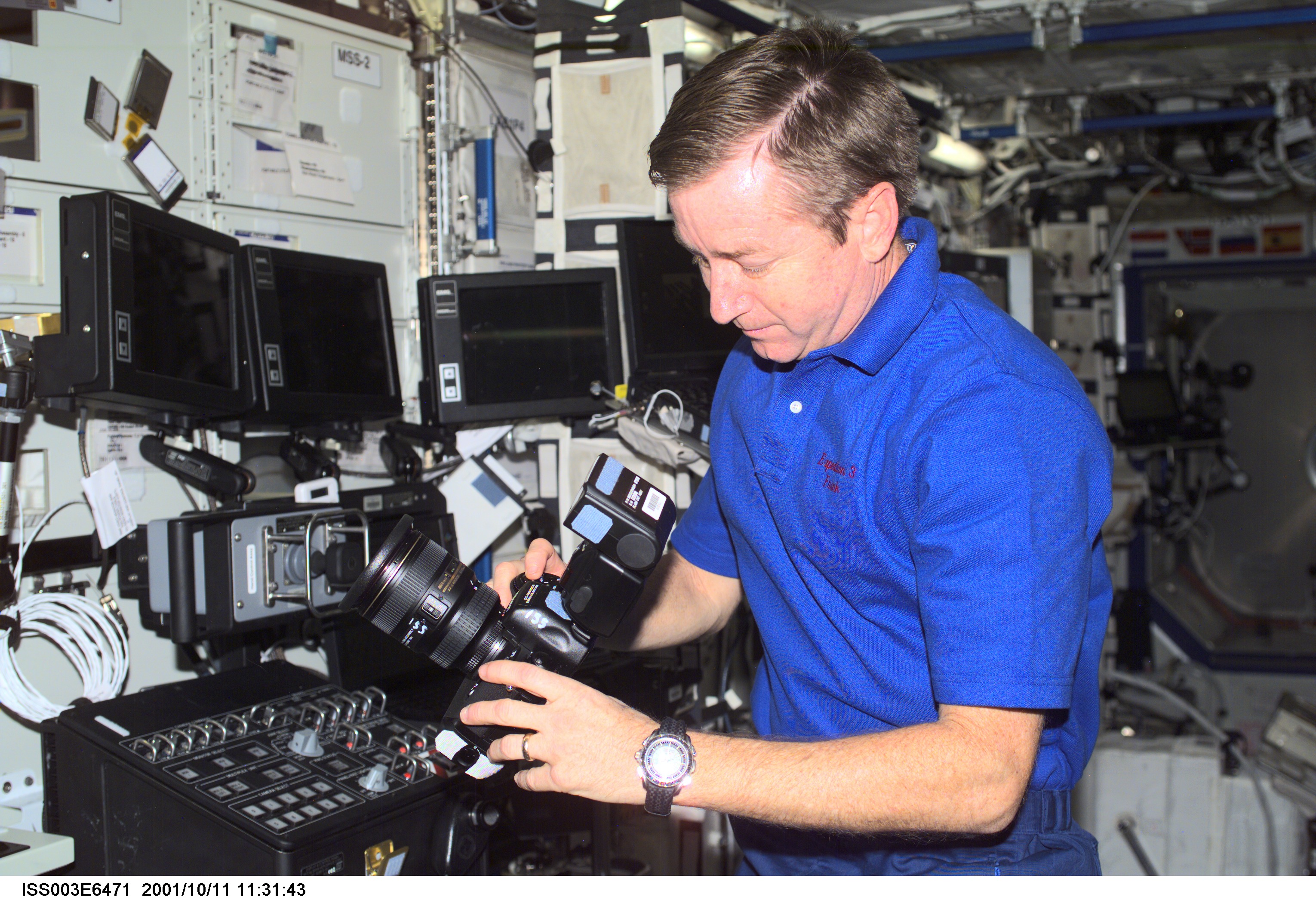 Culbertson works on a camera in the U.S. Laboratory during Expedition Three
