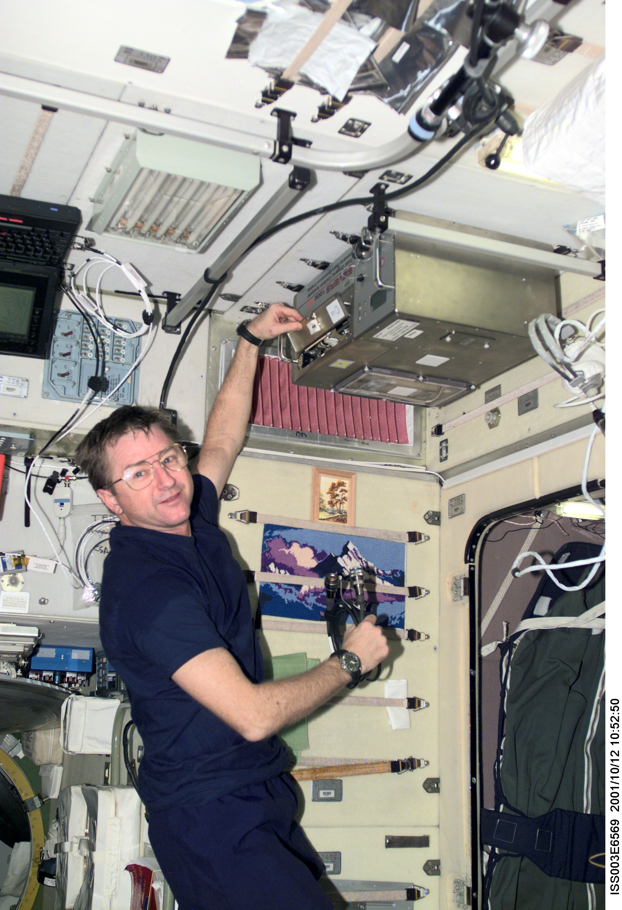Culbertson operates the TOCA hardware in Zvezda during Expedition Three