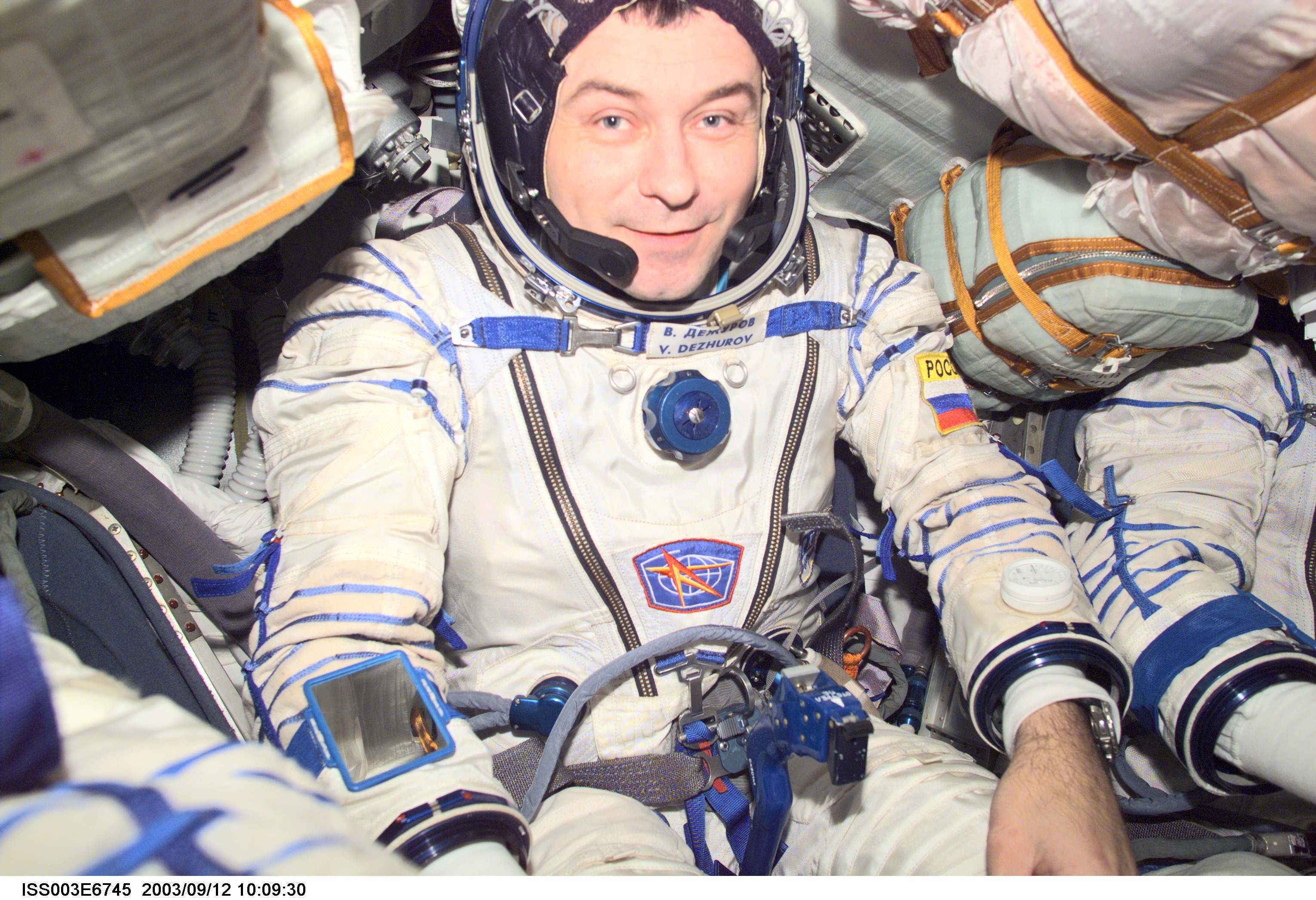 Dezhurov is seated in the Soyuz spacecraft during Expedition Three