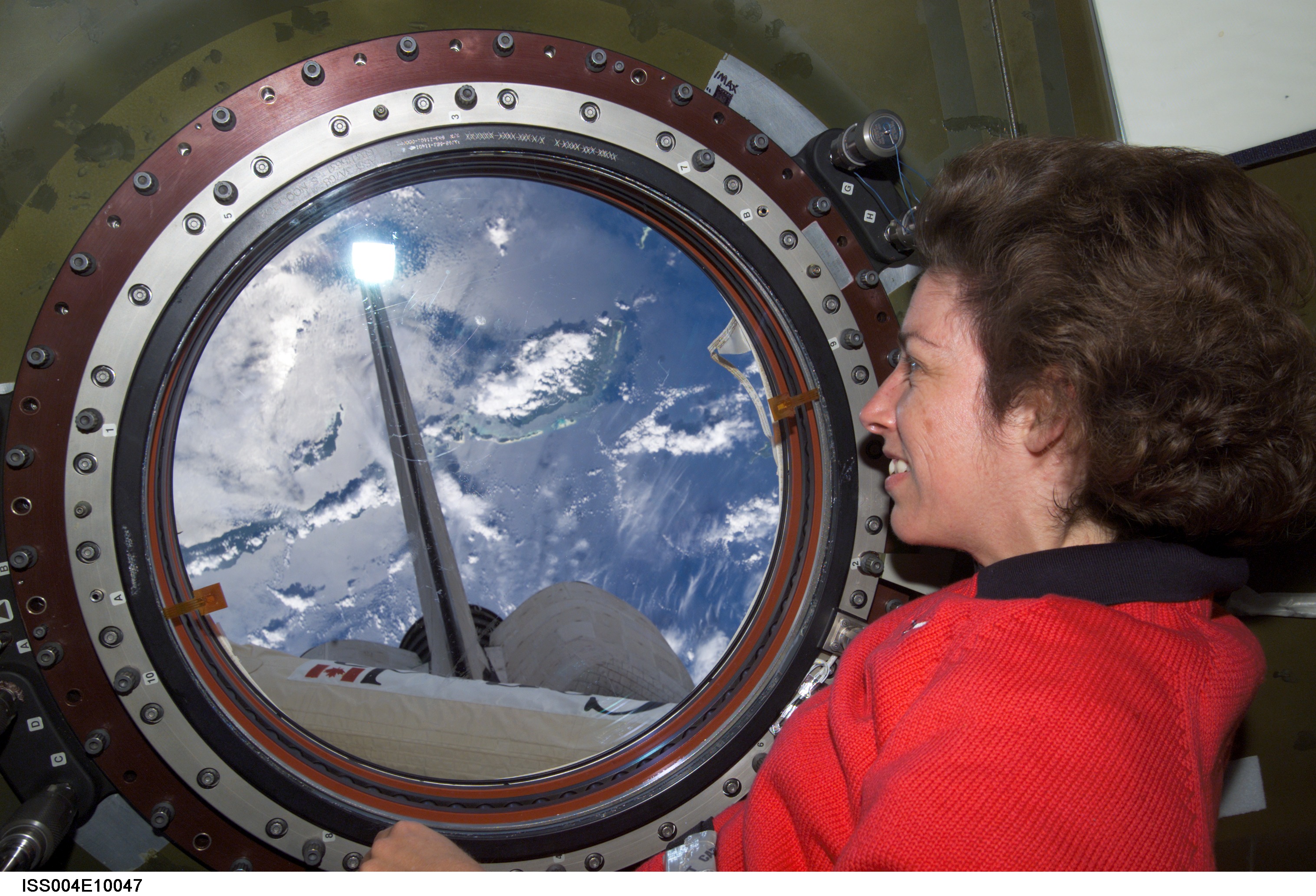 STS-110 MS Ochoa at nadir window in U.S. Lab during Expedition Four