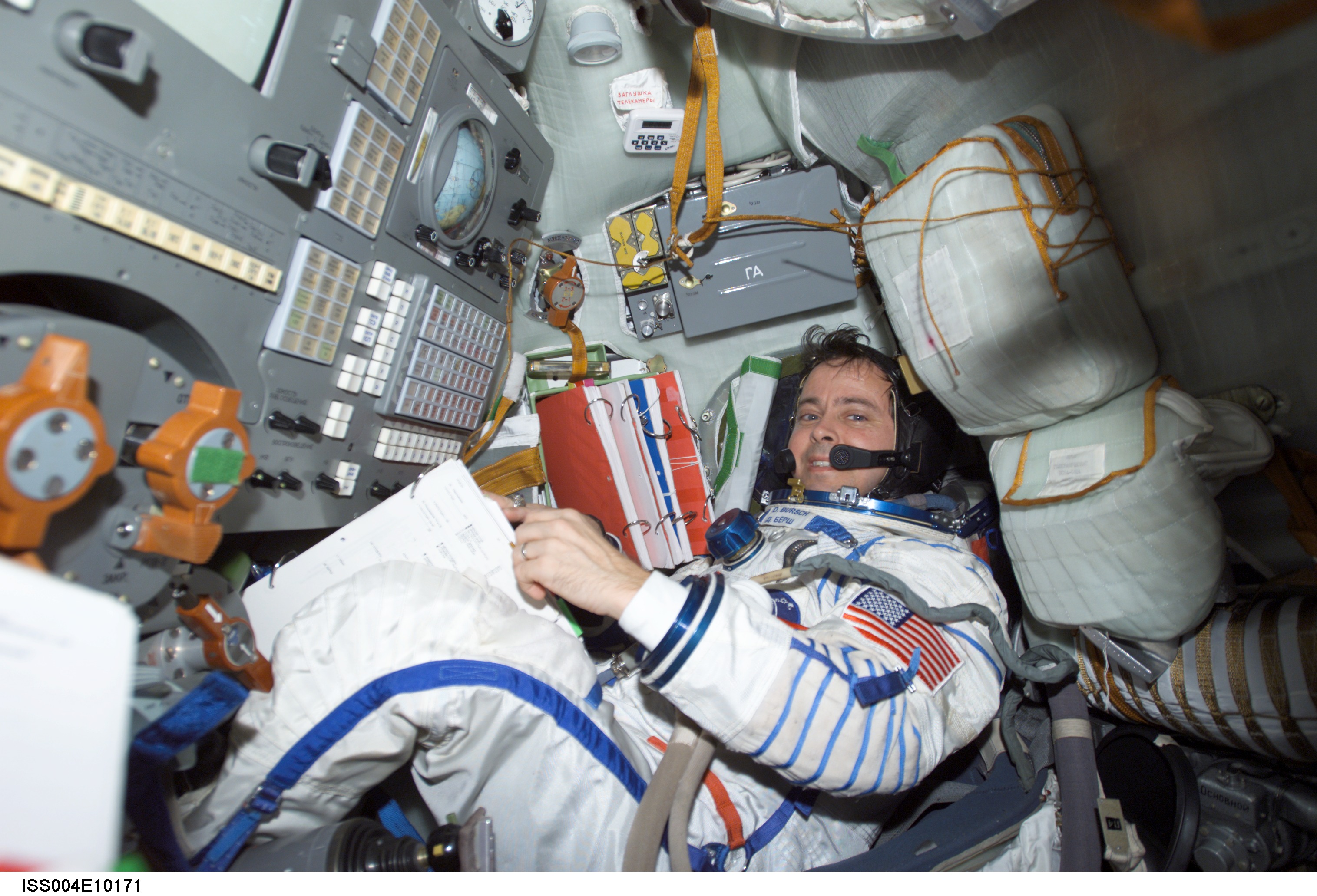 Bursch seated in the Soyuz 3 capsule during Expedition Four rescue craft relocation