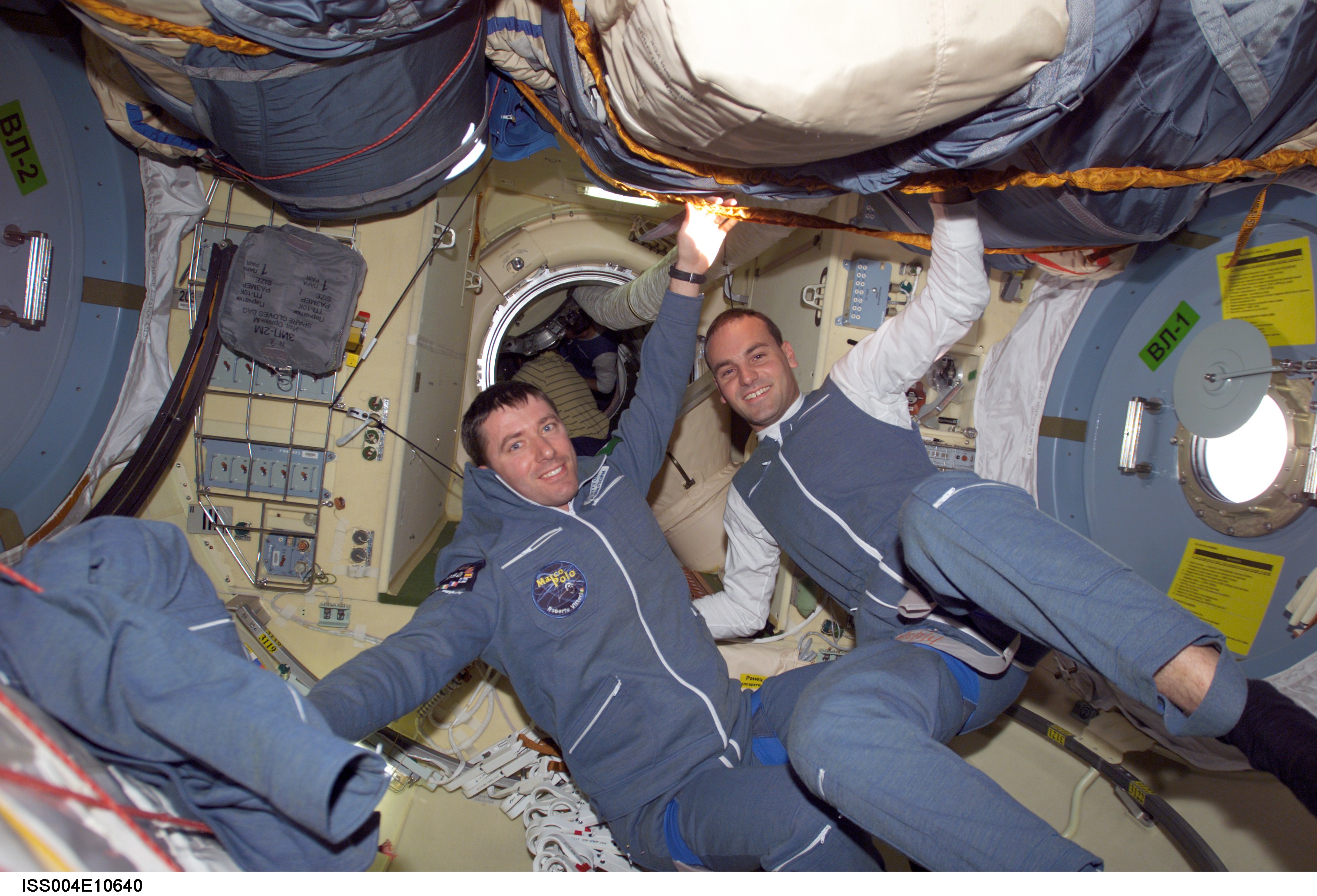 Soyuz 4 FE Vittori and SFP Shuttleworth pose in the FGB during Expedition Four