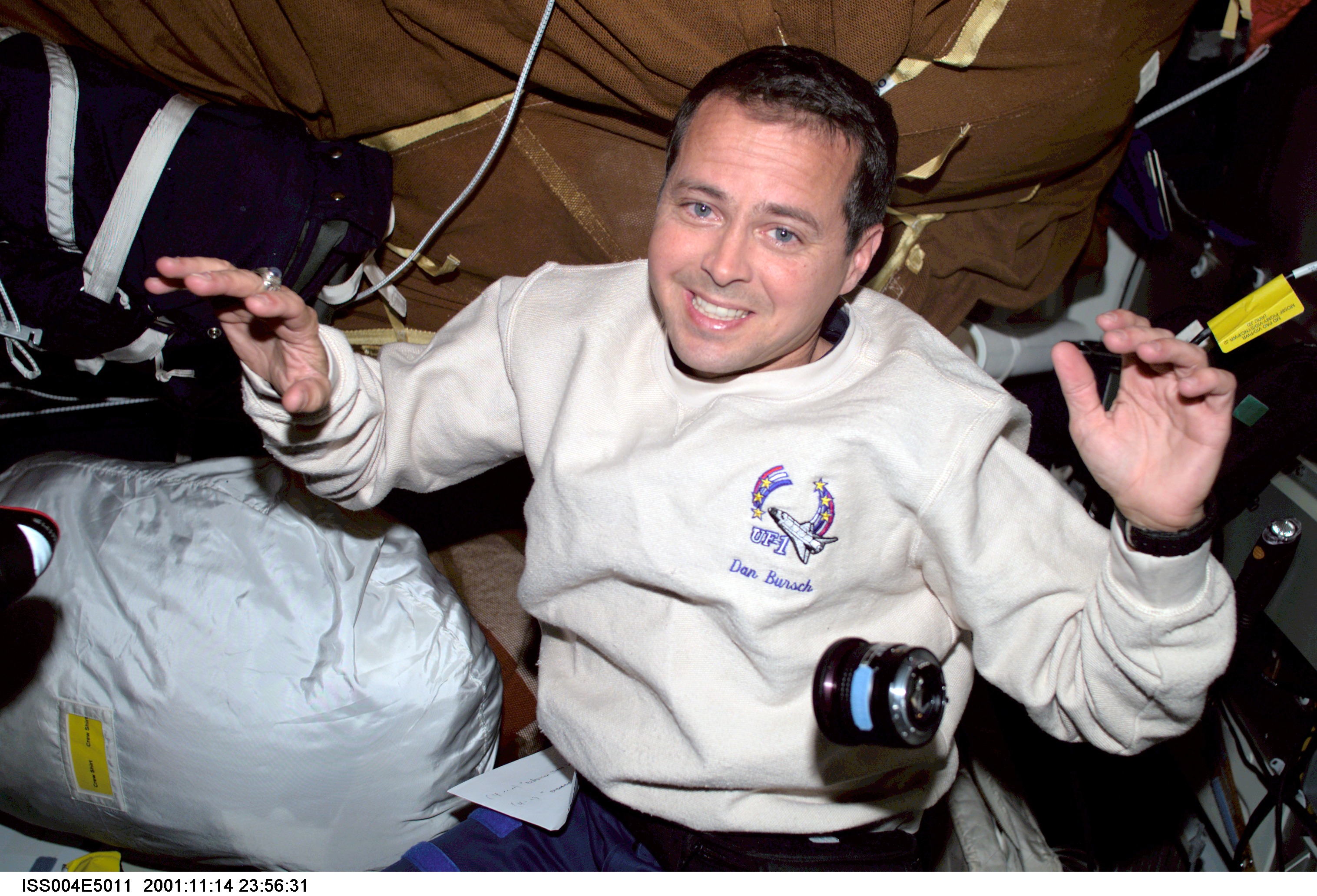 Dan Bursch smiles for the camera from the middeck during Expedition Four