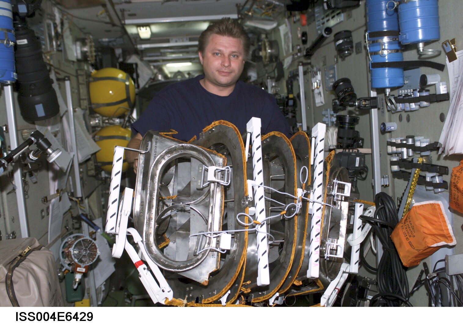 Onufrienko with thruster exhaust plume deflectors in the SM taken Expedition Four