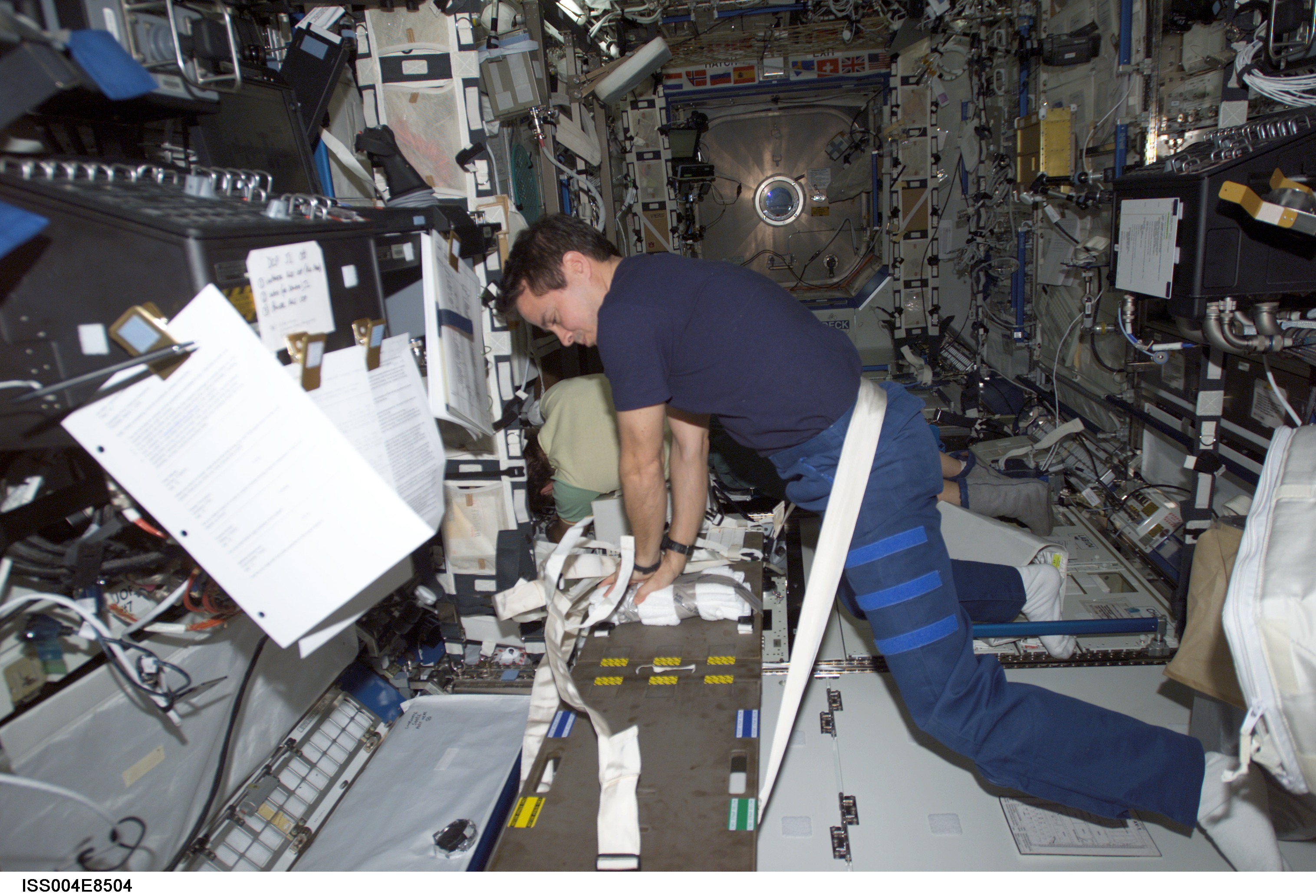 Bursch practices CPR in the U.S. Laboratory during Expedition Four