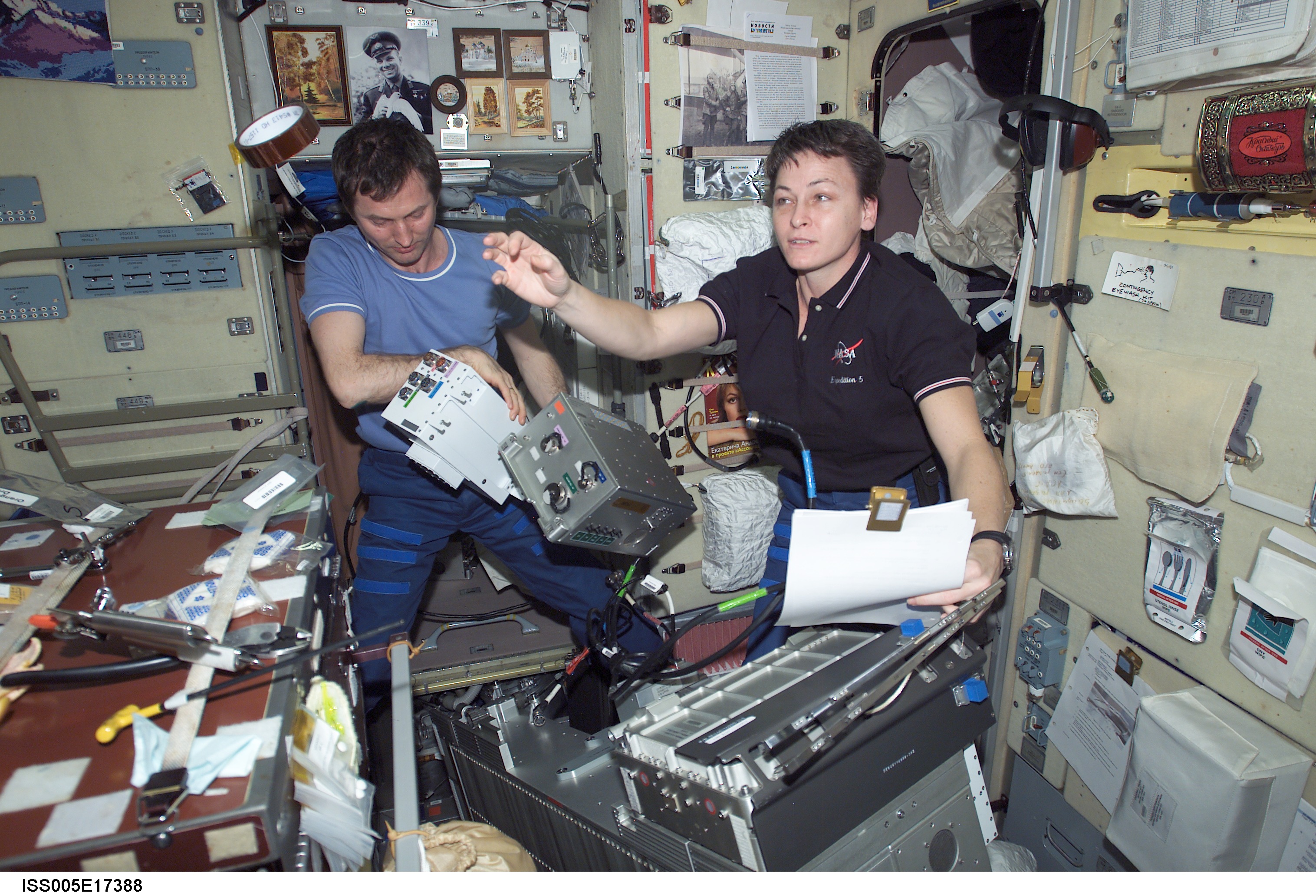 Whitson and Treschev perform maintenance on the TVIS