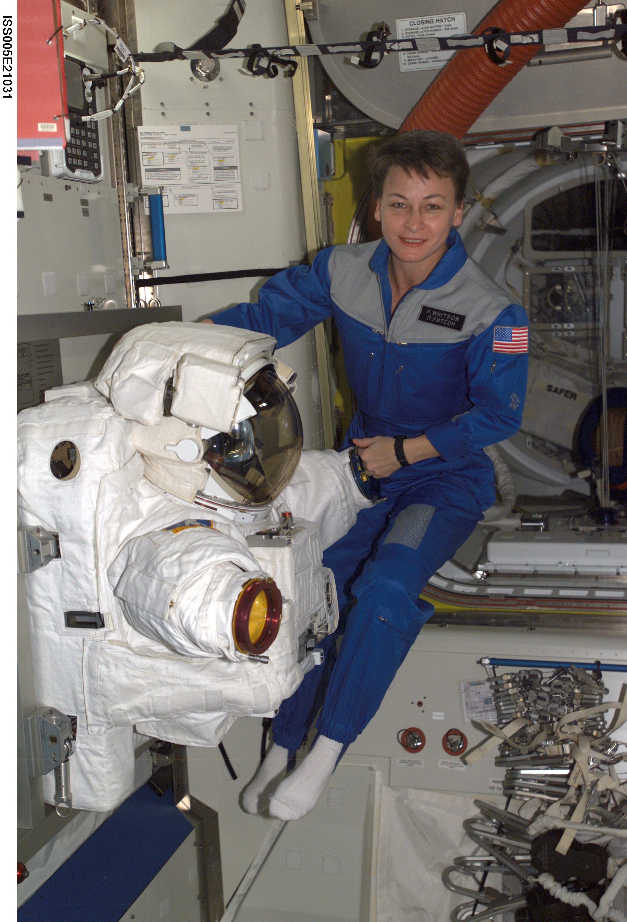 Astronaut Peggy Whitson floats in the Quest/Airlock during Expedition Five on the ISS