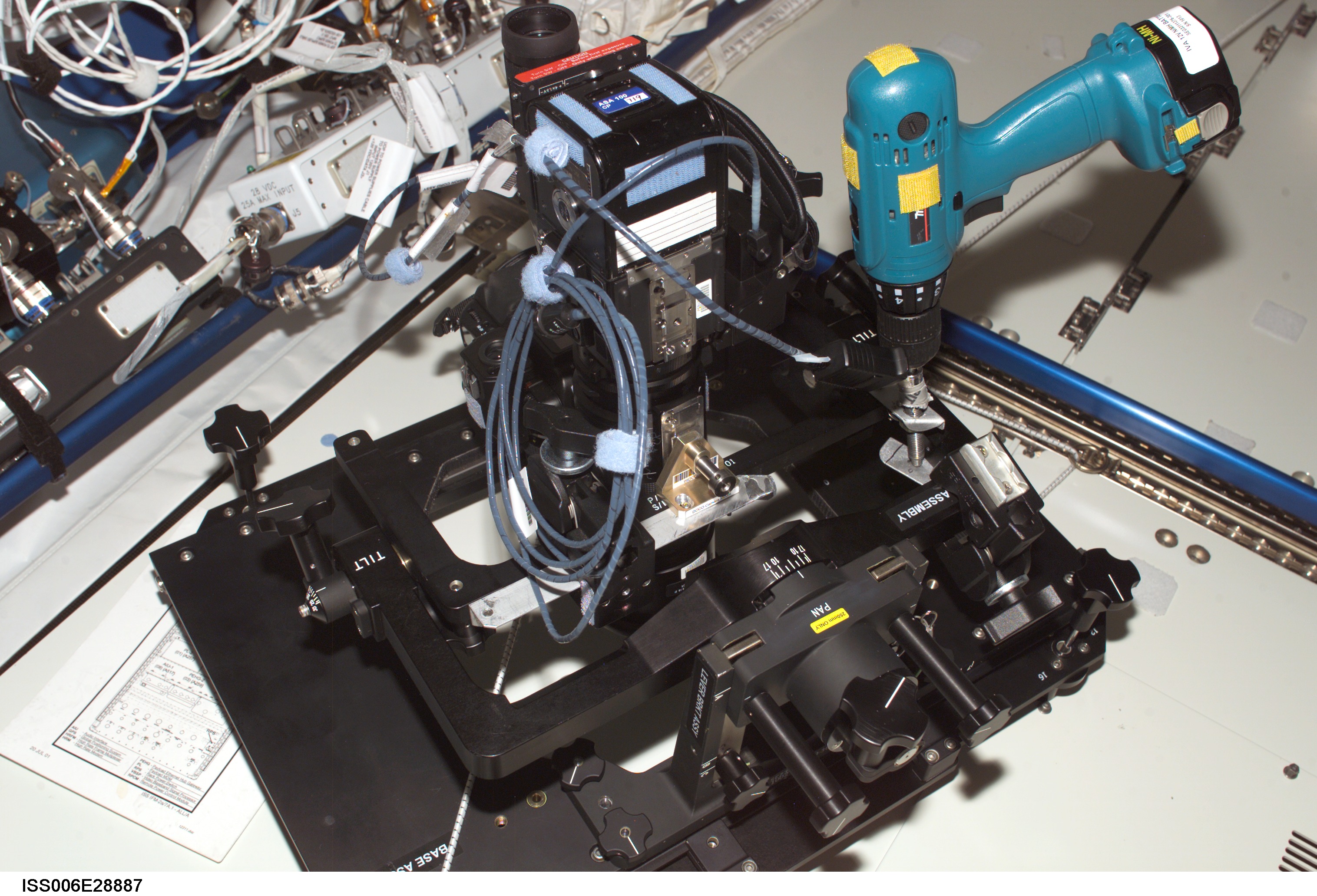 View of a "barn door tracker" mounted on a camera in the U.S. Laboratory during Expedition Six