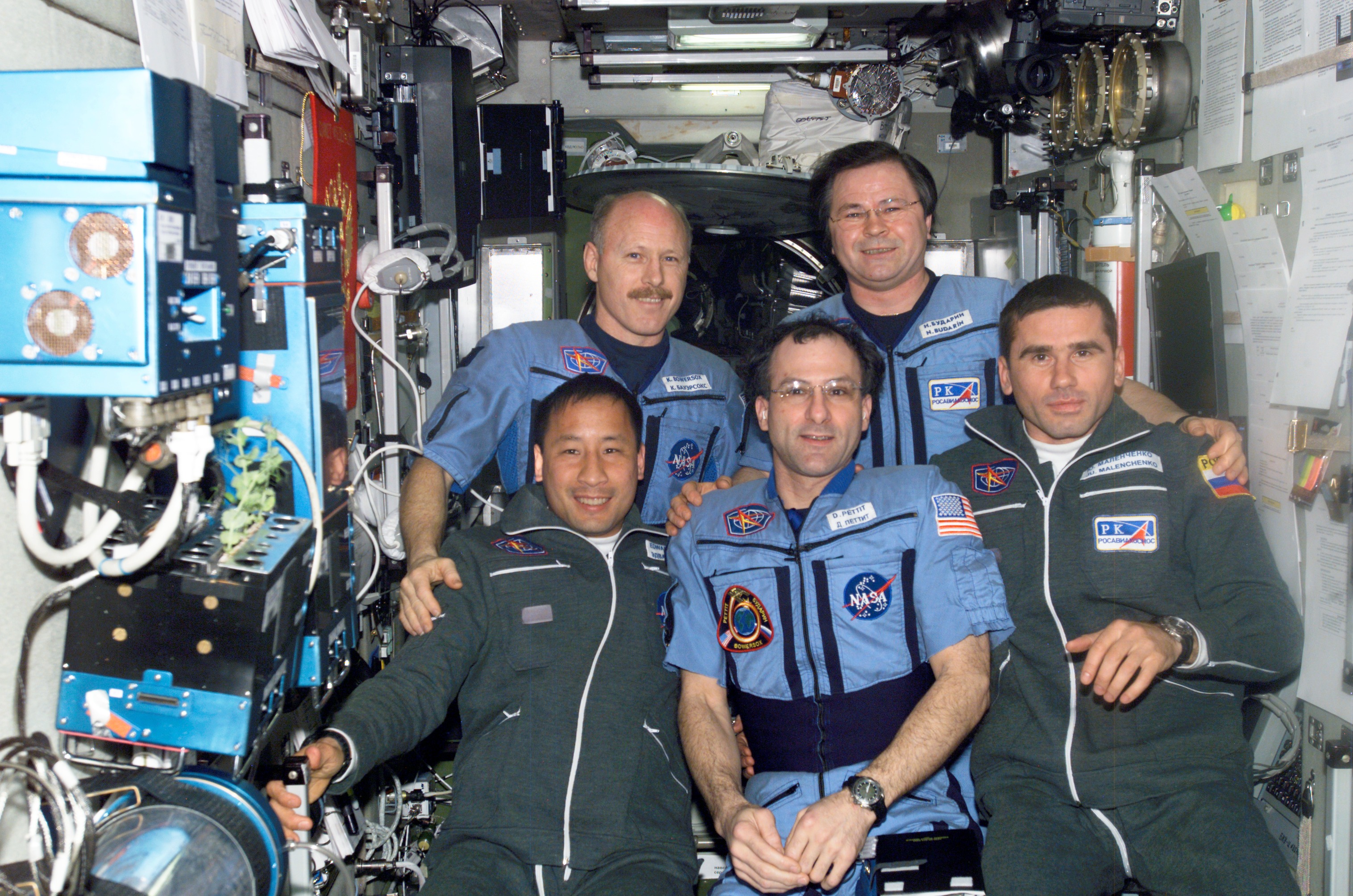Expedition Six and Seven crews pose for a group photo in the SM