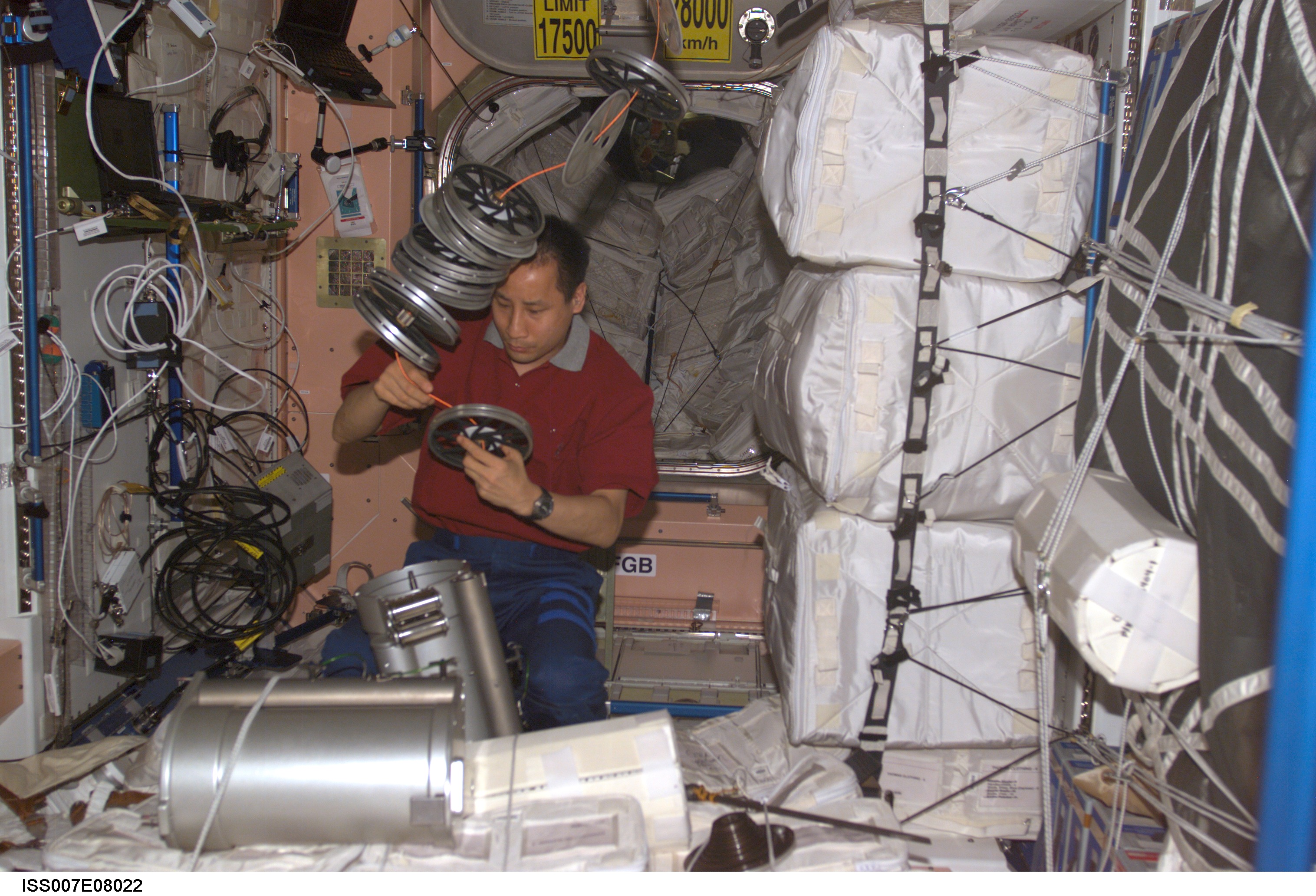 Expedition Seven Science Officer Lu works with IRED hardware in Node 1/Unity