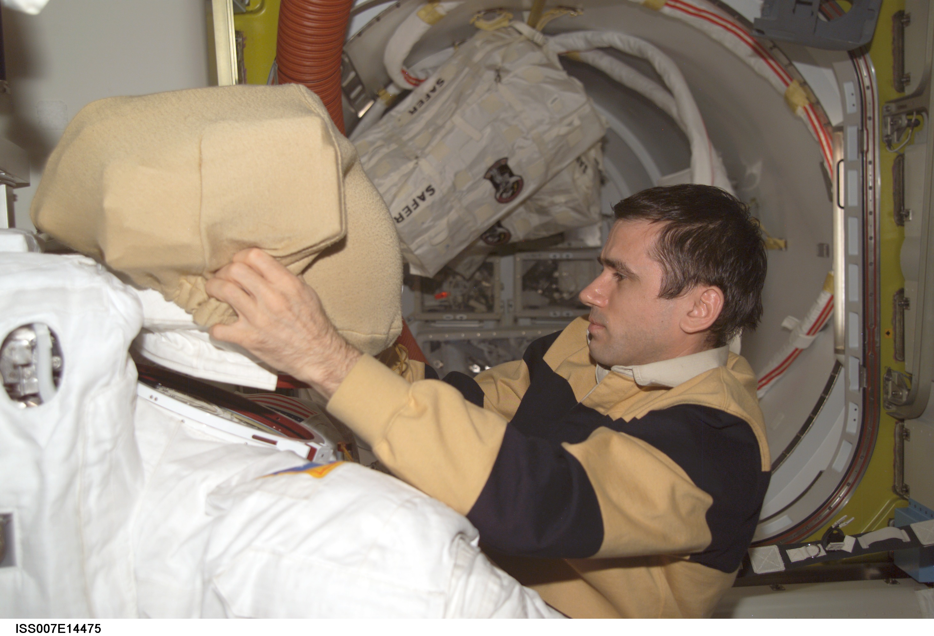 Expedition Seven Malenchenko with EMU in Quest airlock