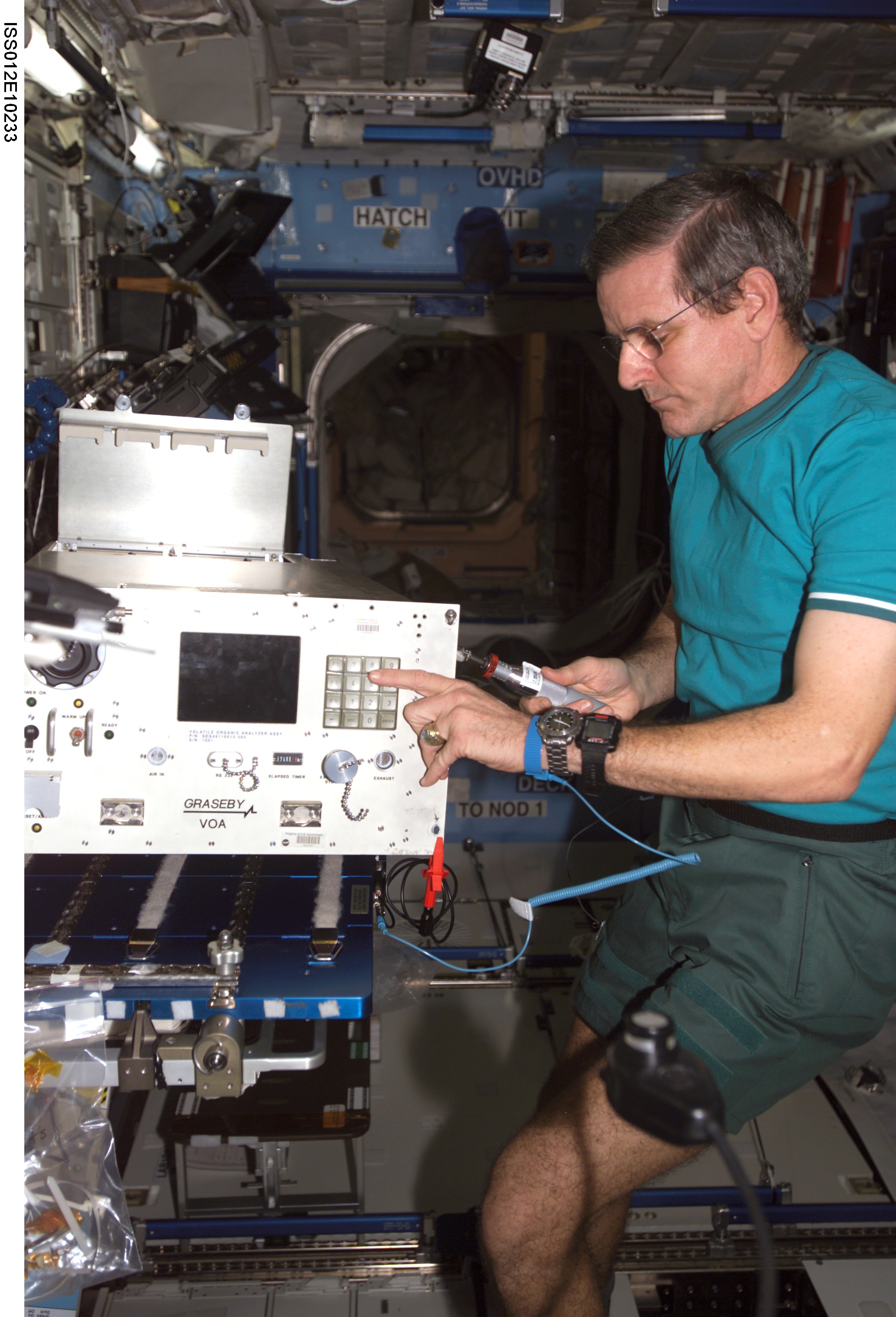 McArthur replaces the top panels on the VOA during In-flight Maintenance on Expedition 12