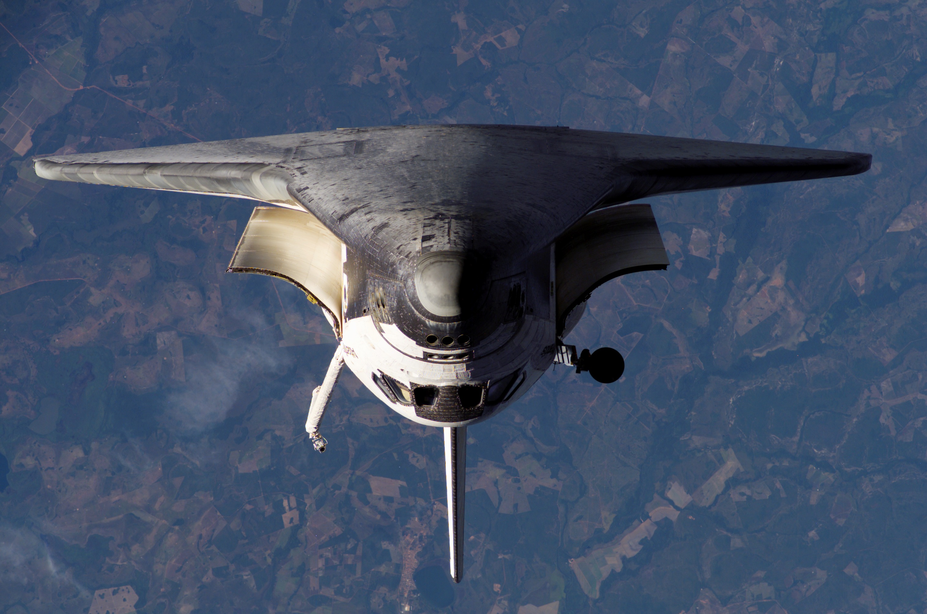 Atlantis and Payload on approach to the ISS during the STS-117 Mission