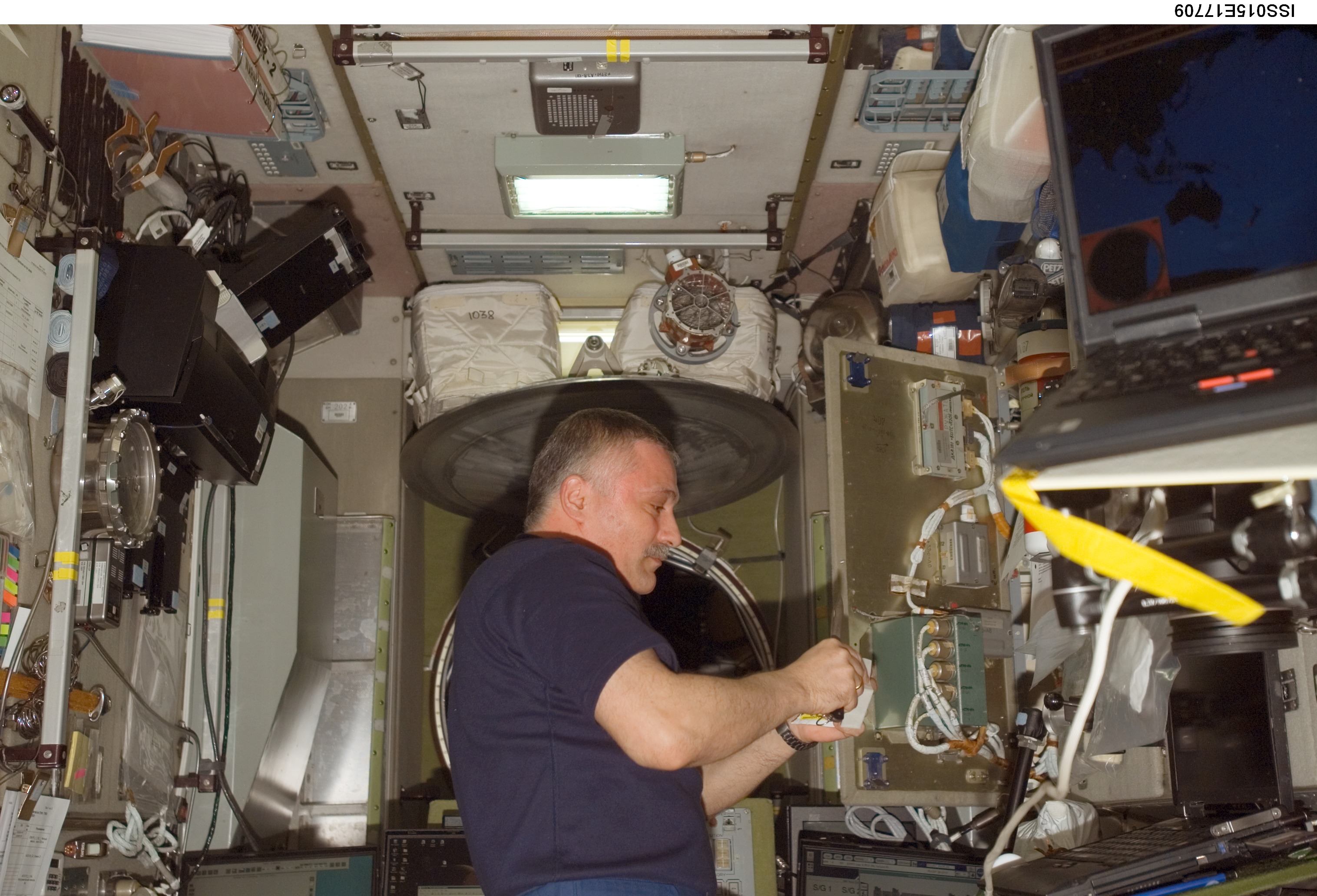 View of Yurchikhin working on SMCC2 Command Processing Unit during Expedition 15