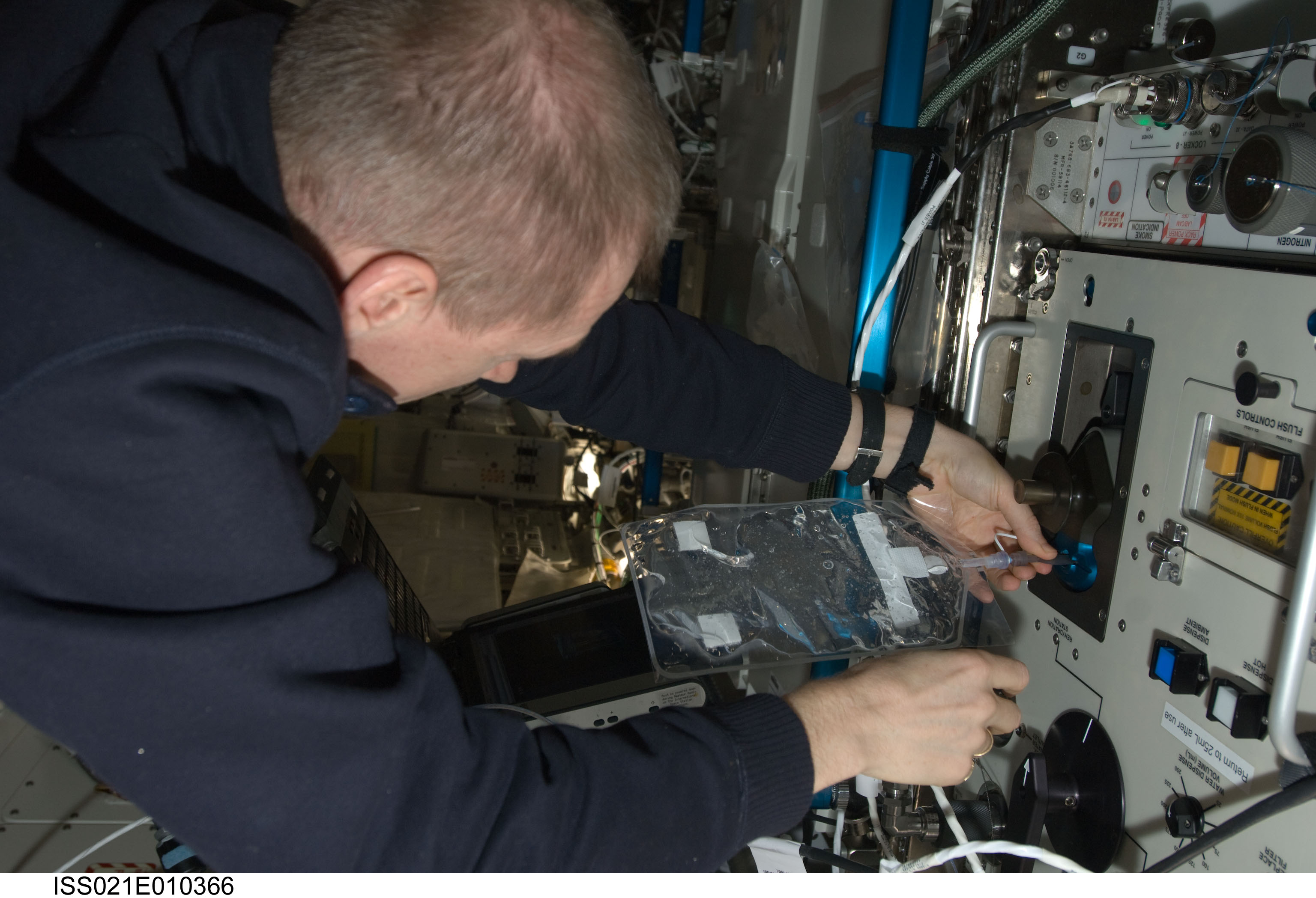 CDR De Winne takes Water Samples for analysis in the US Lab
