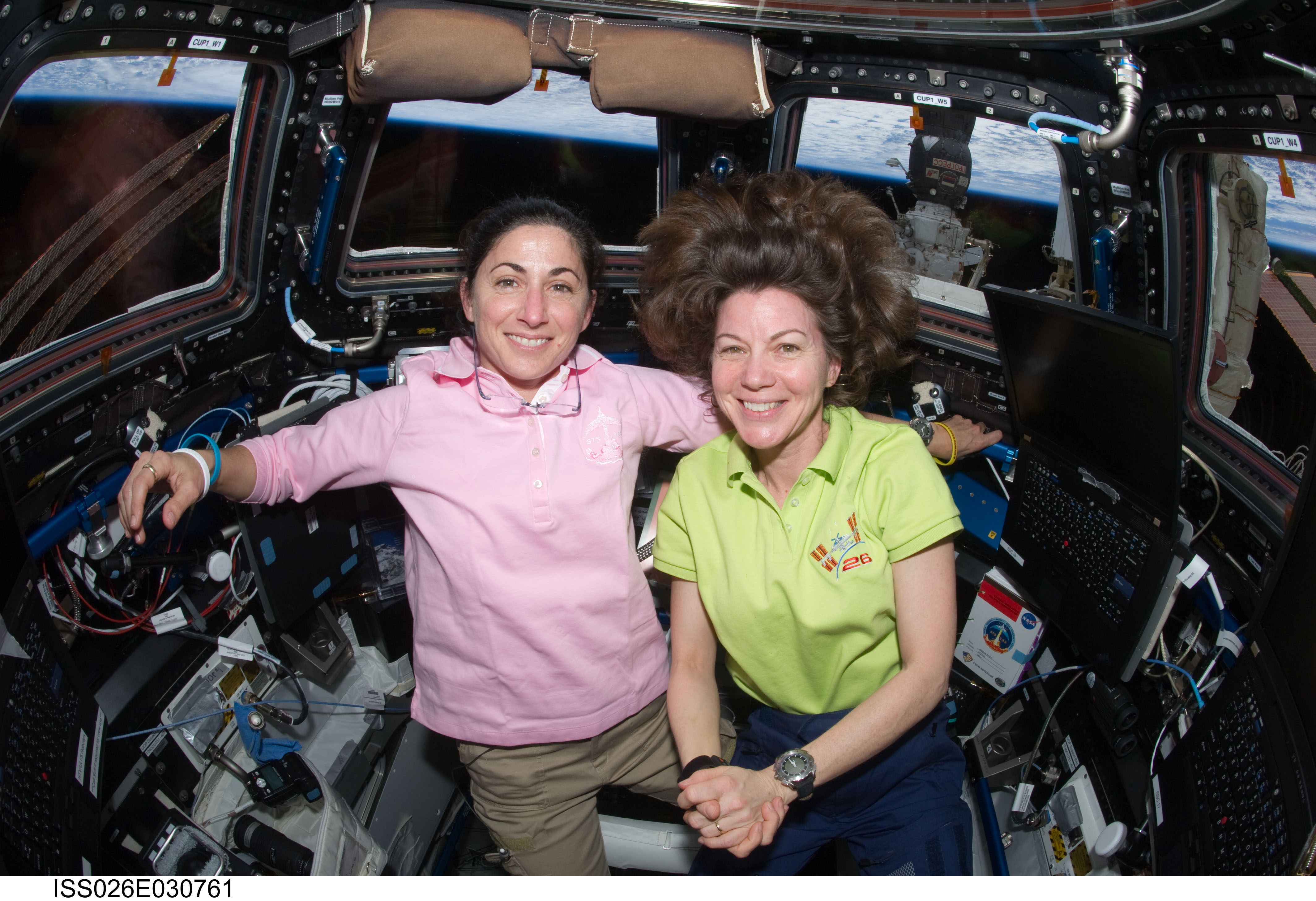 Stott and Coleman pose in the Cupola Module