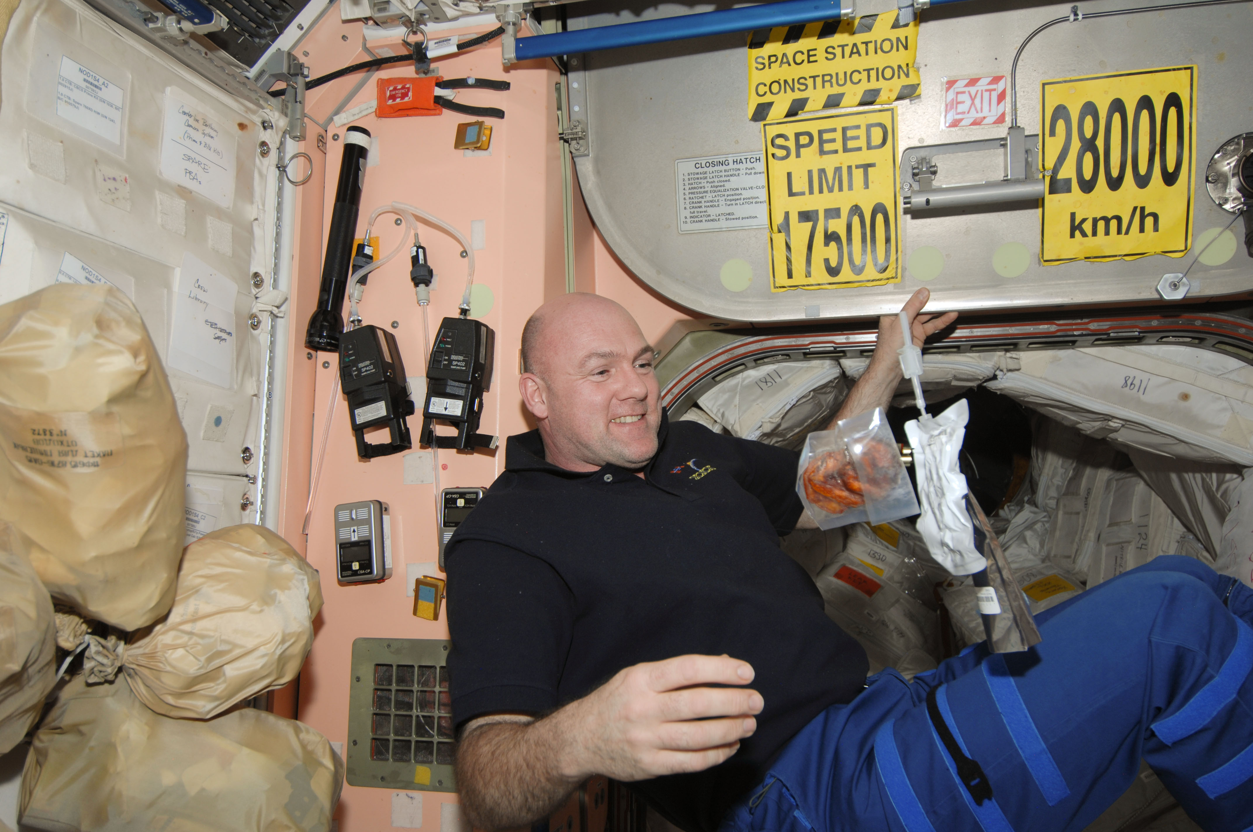 Kuipers watches food and drink packets float in the Node 1