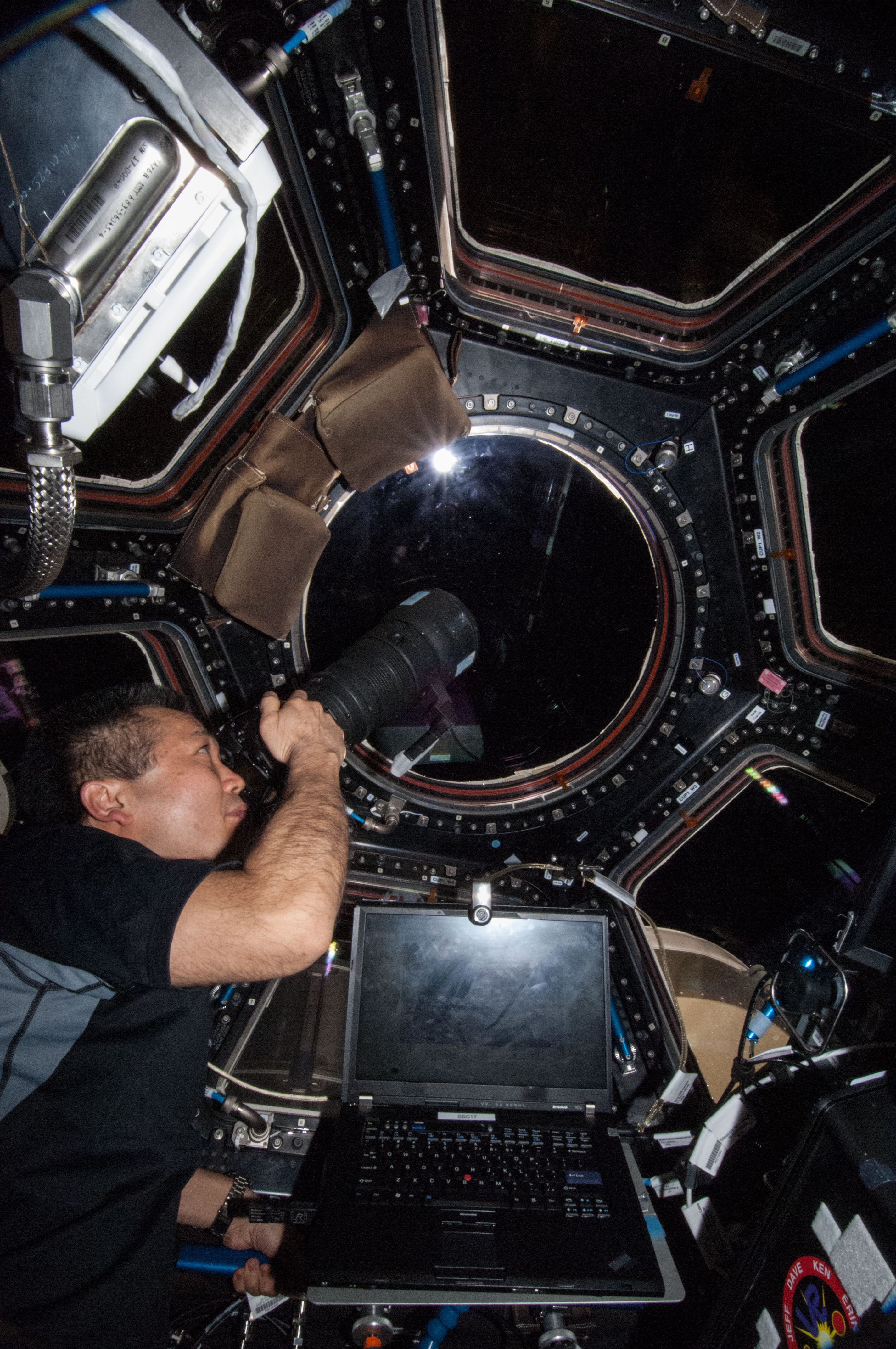 Wakata using still camera in the Cupola Module