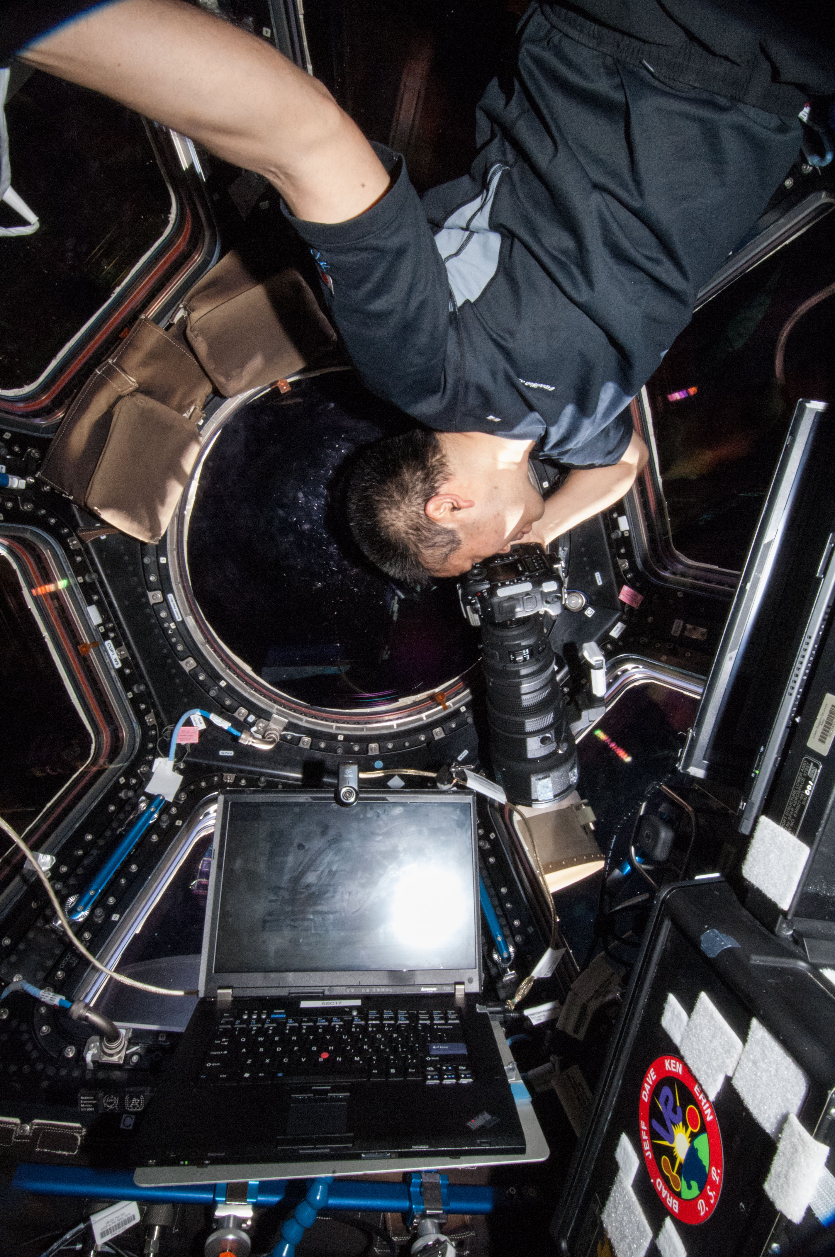 Wakata using still camera in the Cupola Module