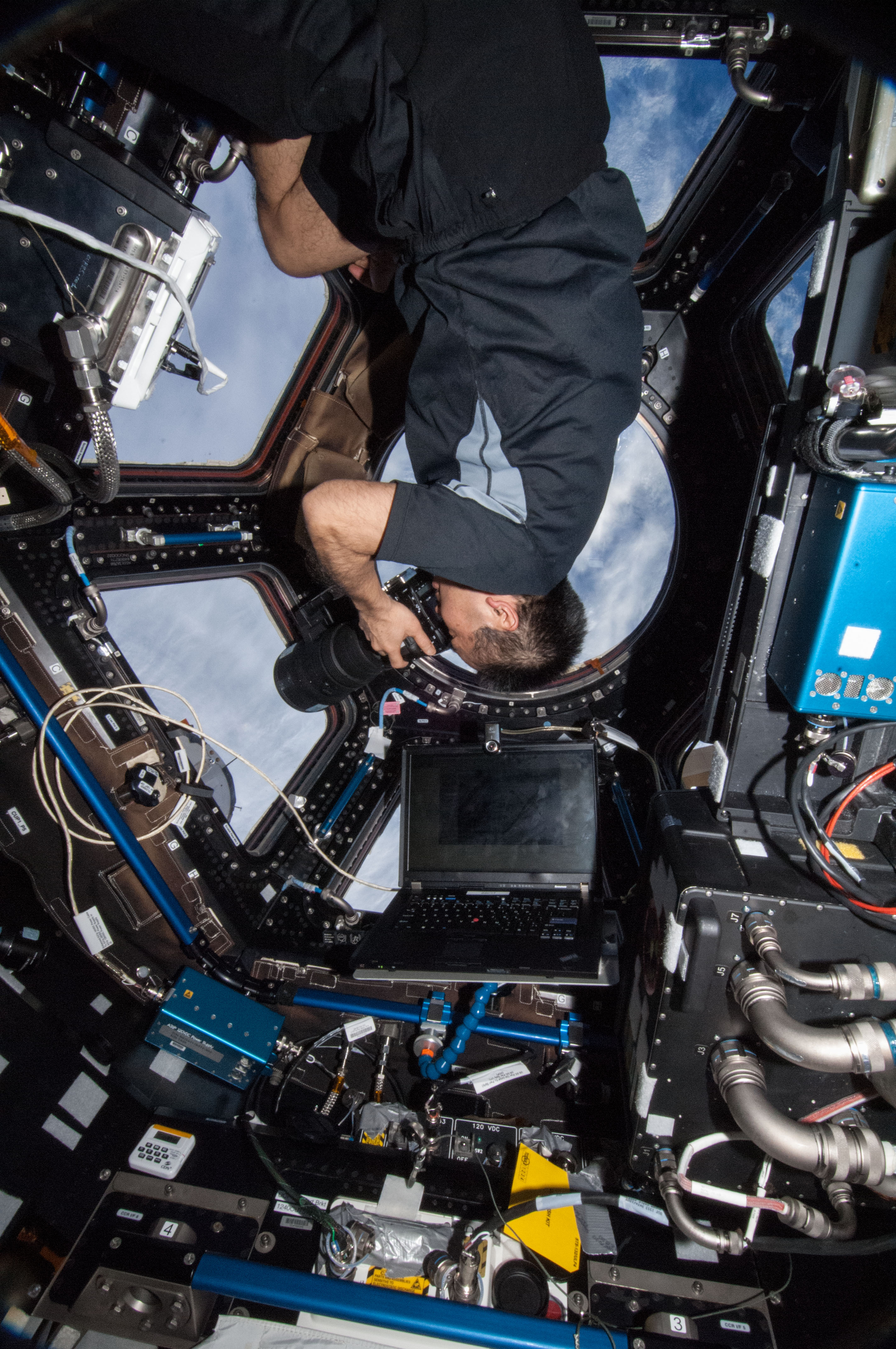 Wakata using still camera in the Cupola Module