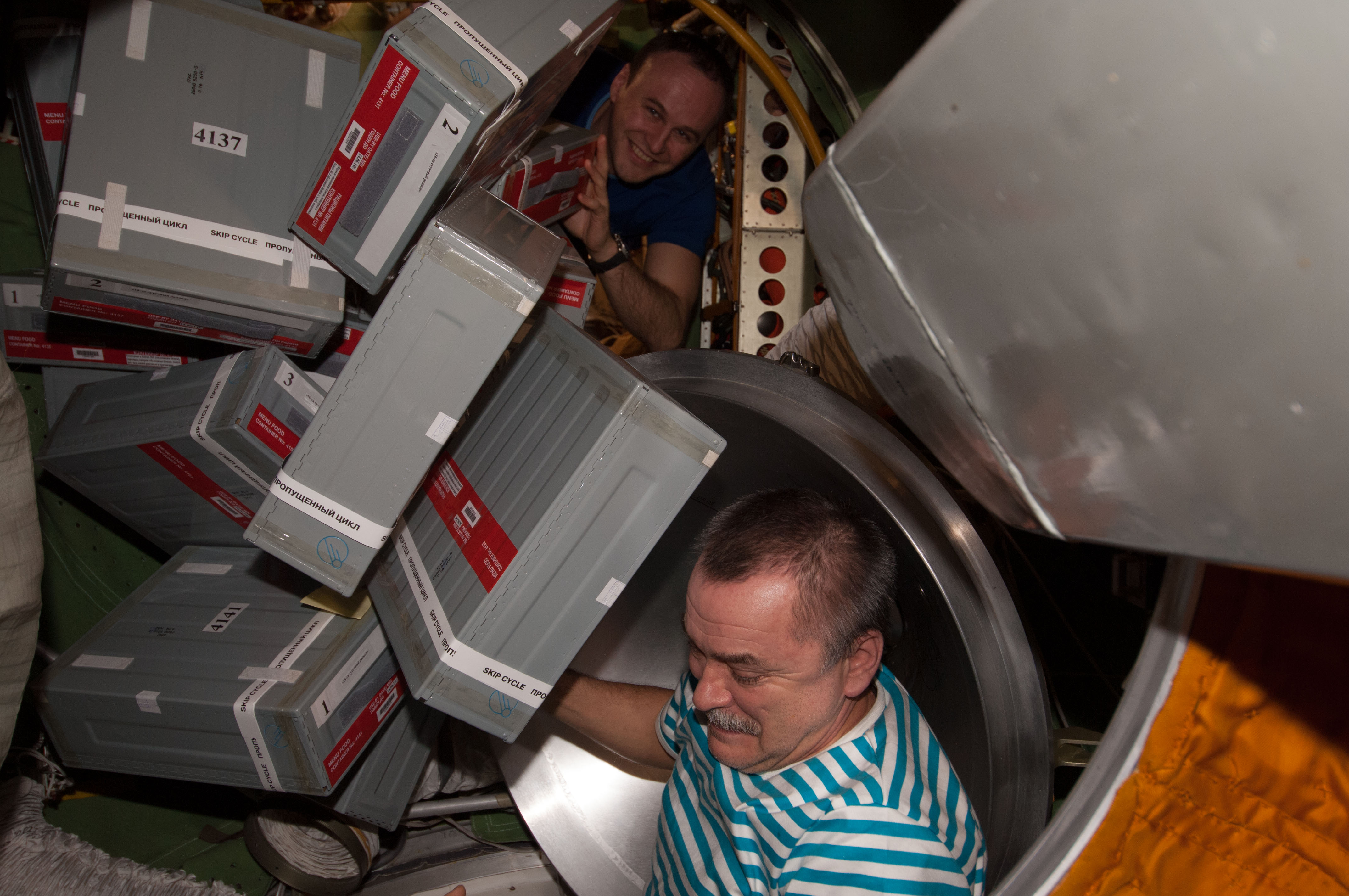 Tyurin and Ryazanskiy unpacks Storage Containers