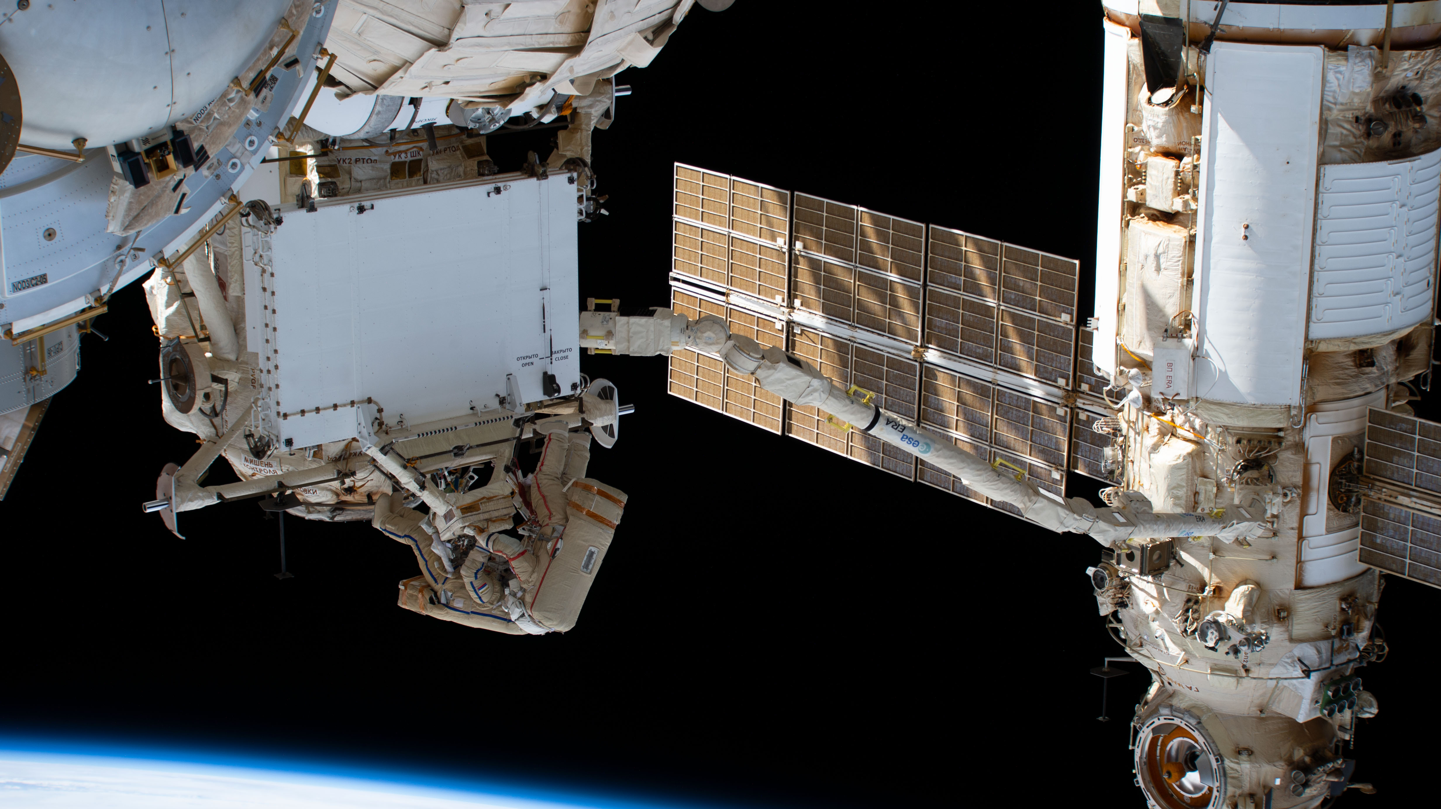 Roscosmos spacewalkers remove a radiator on the Rassvet module