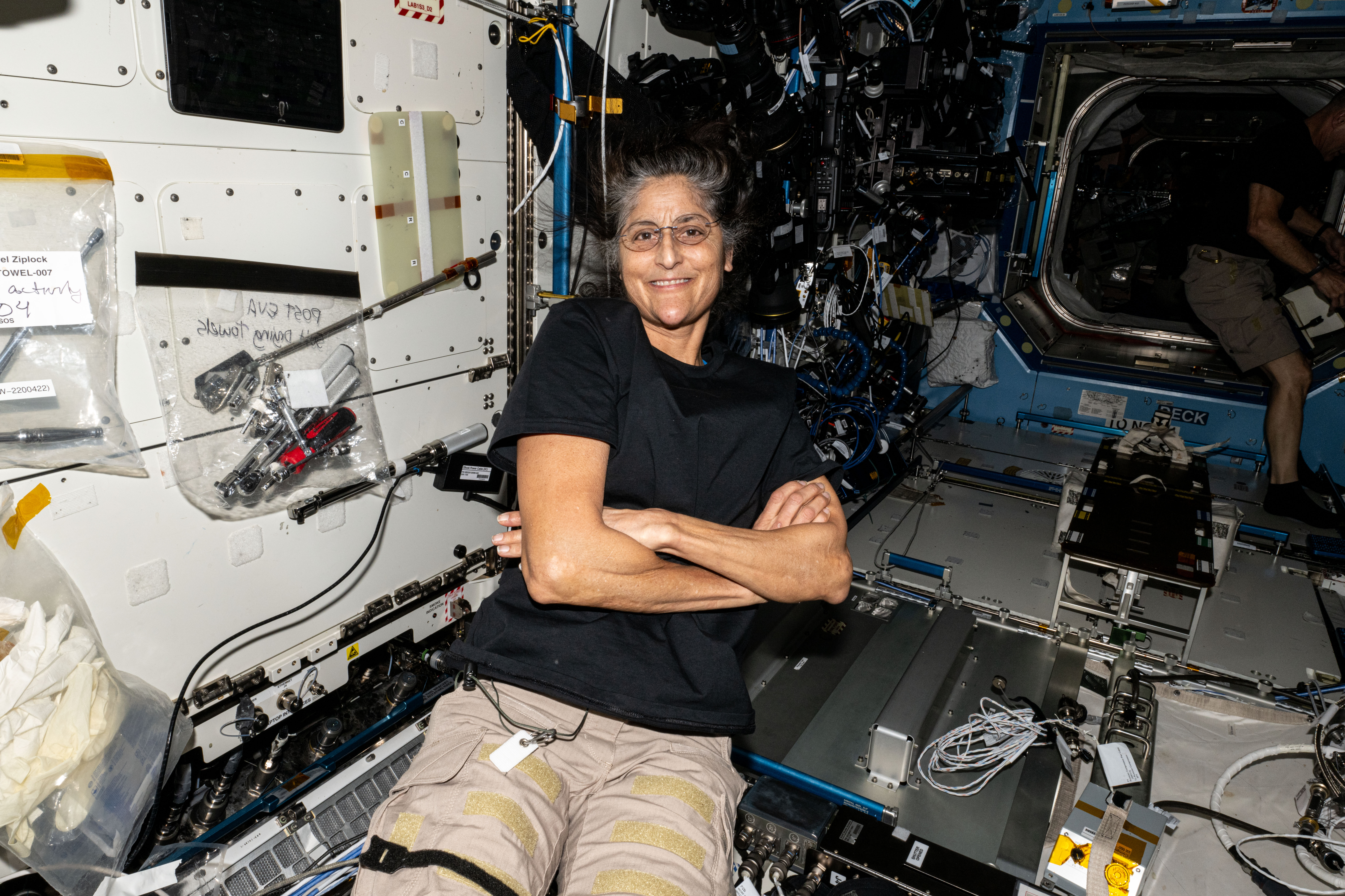 NASA astronaut Suni Williams smiles for a photograph aboard the International Space Station