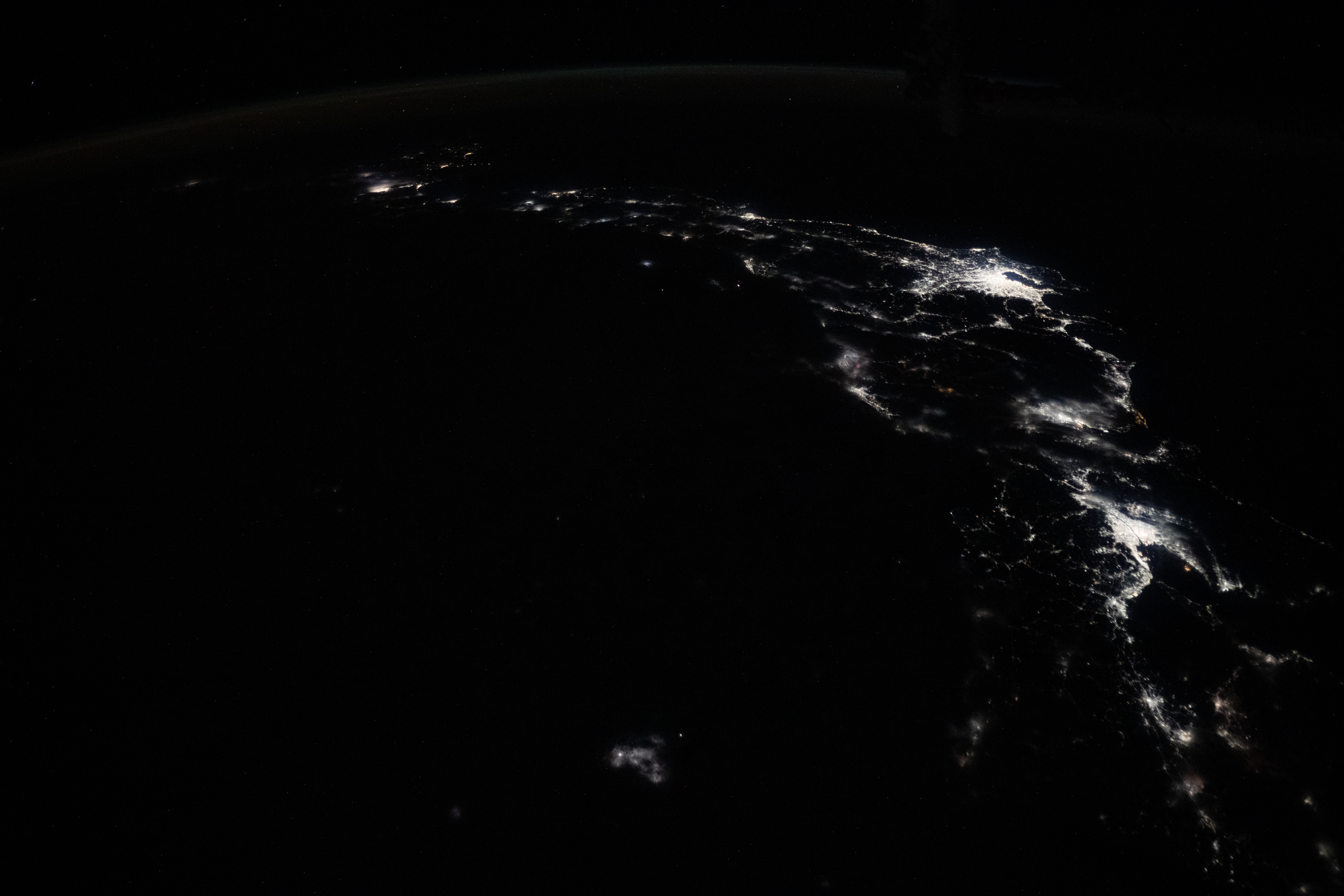 The city lights of Osaka, Nagoya, and Tokyo on the island nation of Japan